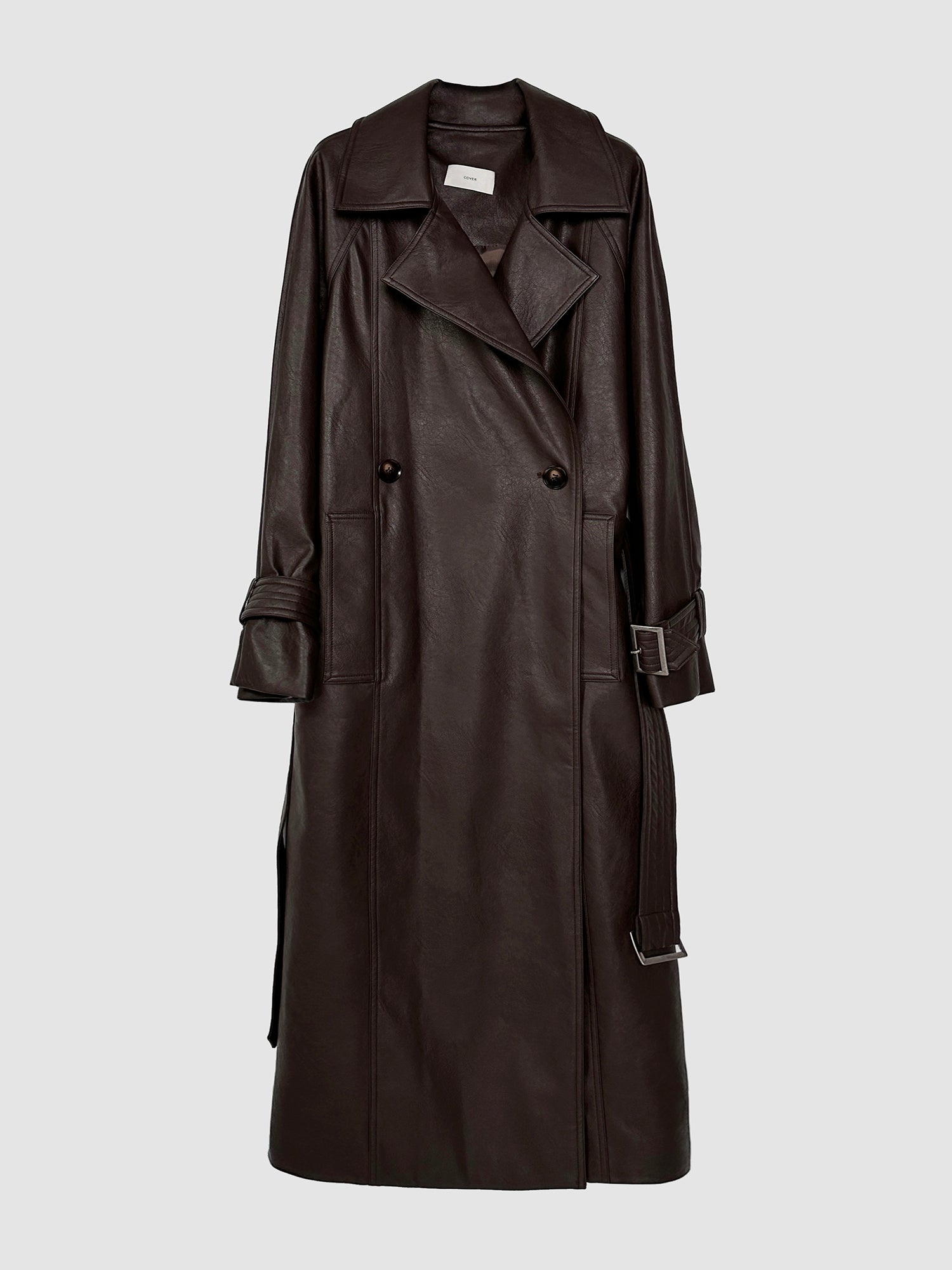 Detailed product view of the belted leather trench coat, featuring its front detailed designs, emanating a classy yet chic Korean street style.