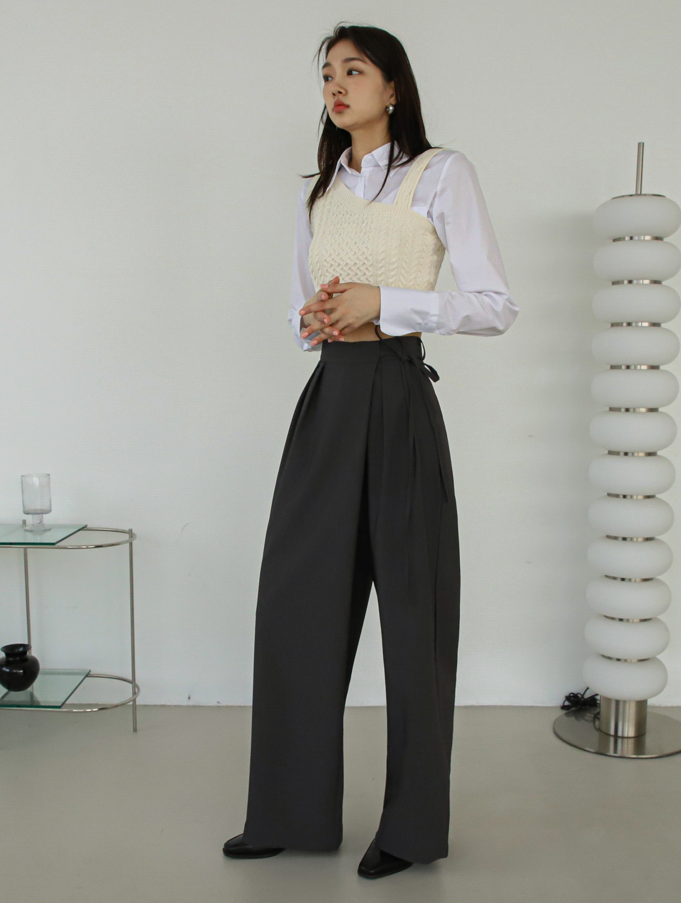 A side angle of the belt tie pants showing the side fitting of the pants.