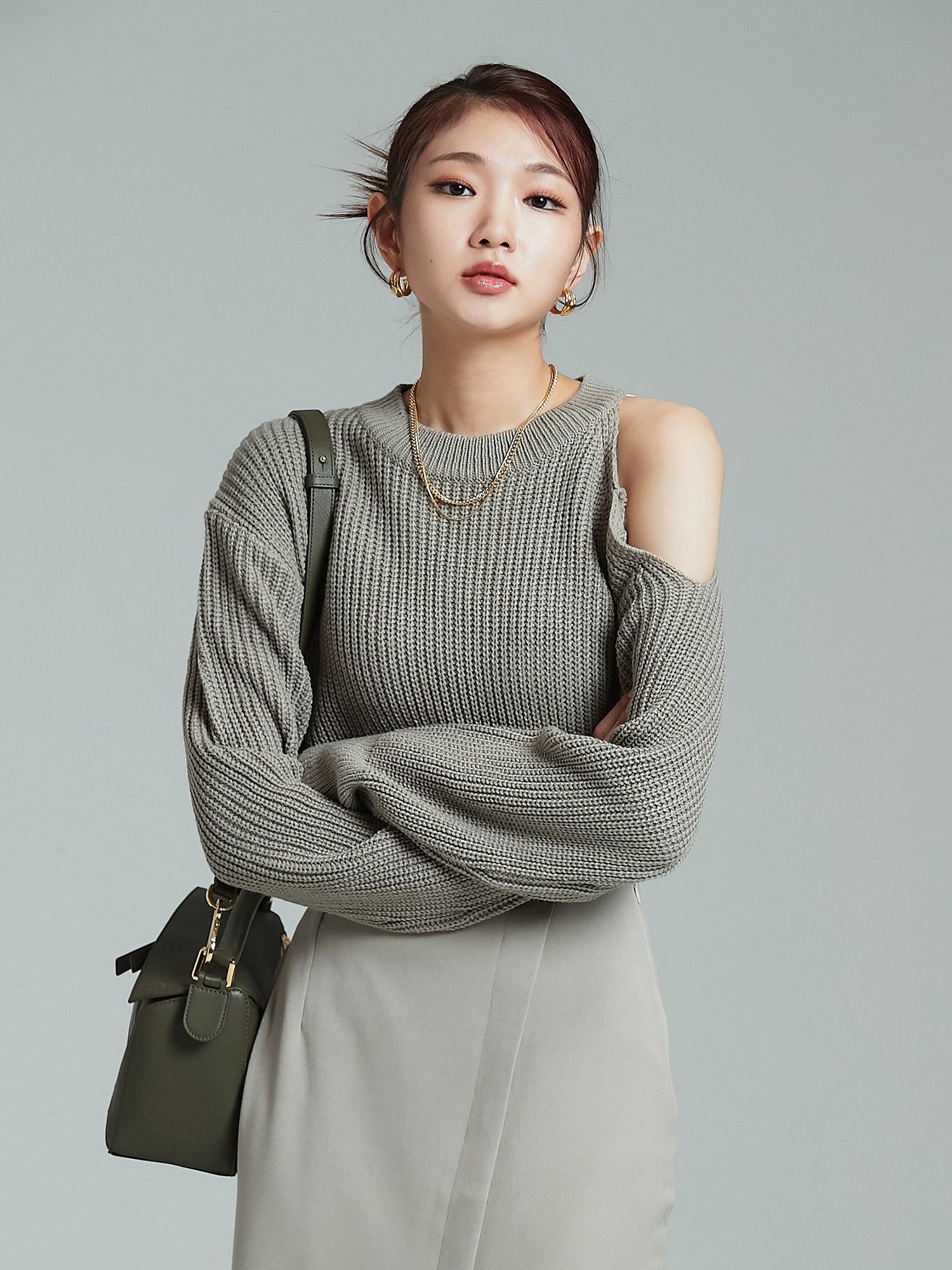 A close-up shot of the model wearing the cold shoulder sweater showcasing the korean aesthetic outfits vibe.