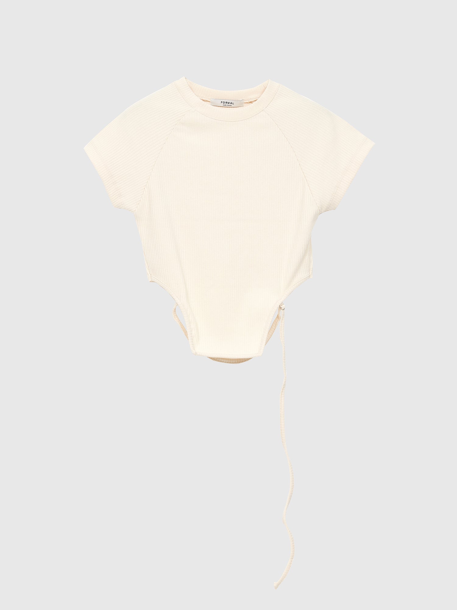 A product detailed view of the cream crop top with strap, showcasing its front design and versatility for Korean aesthetic outfits.