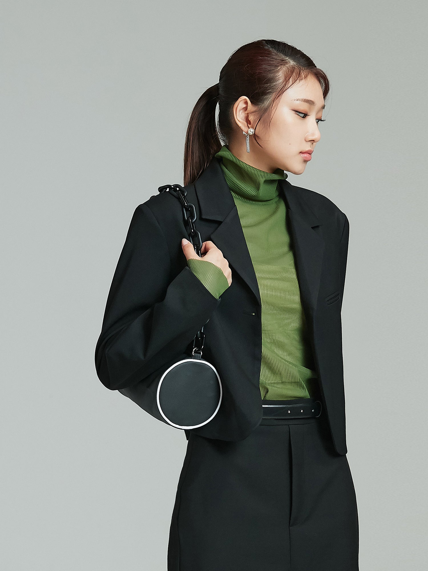 Tilted angle of the black blazer showcasing the korean street style look.