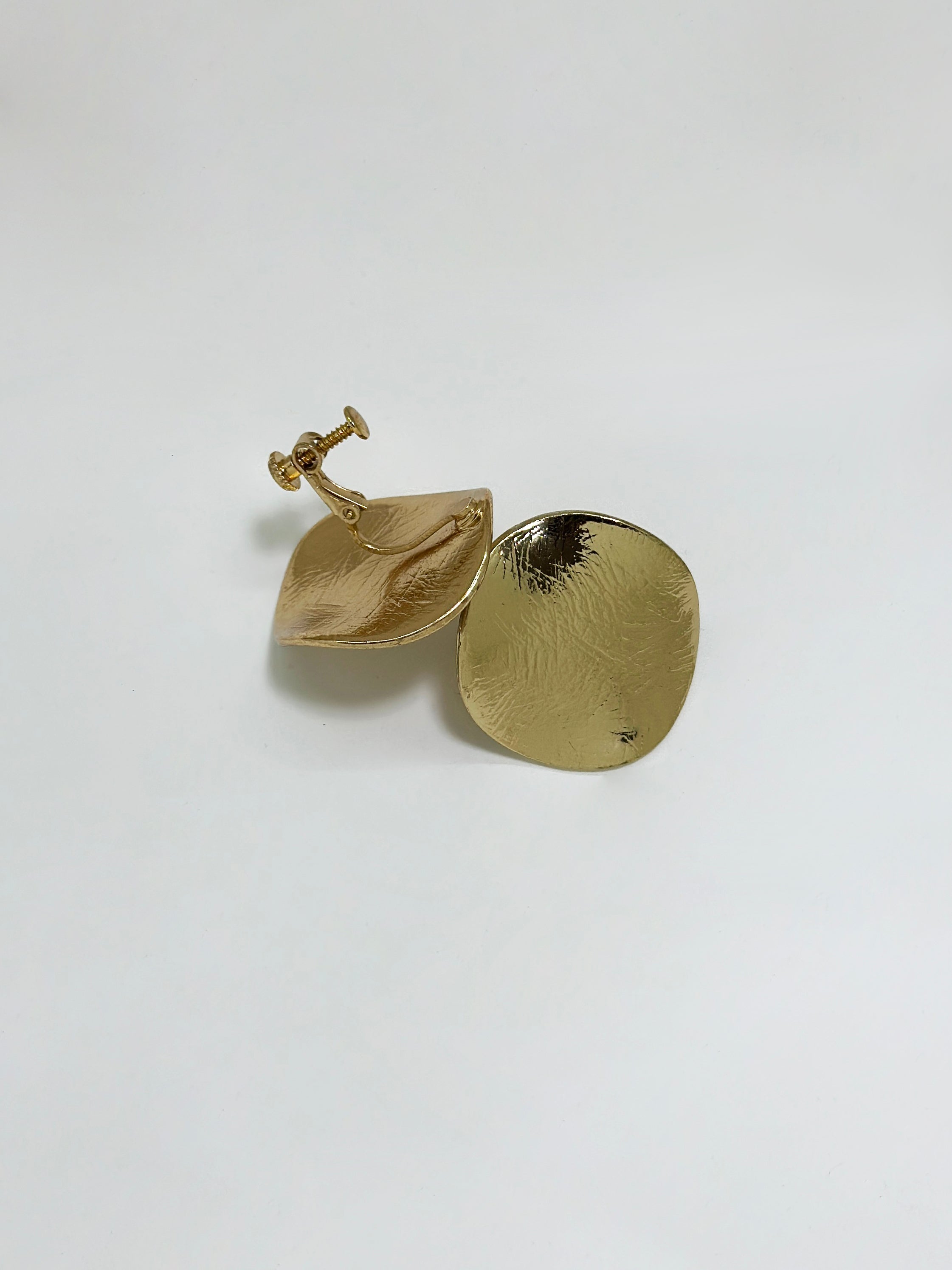 Product detailed view of the gold filled disc earring showing the front and back details.