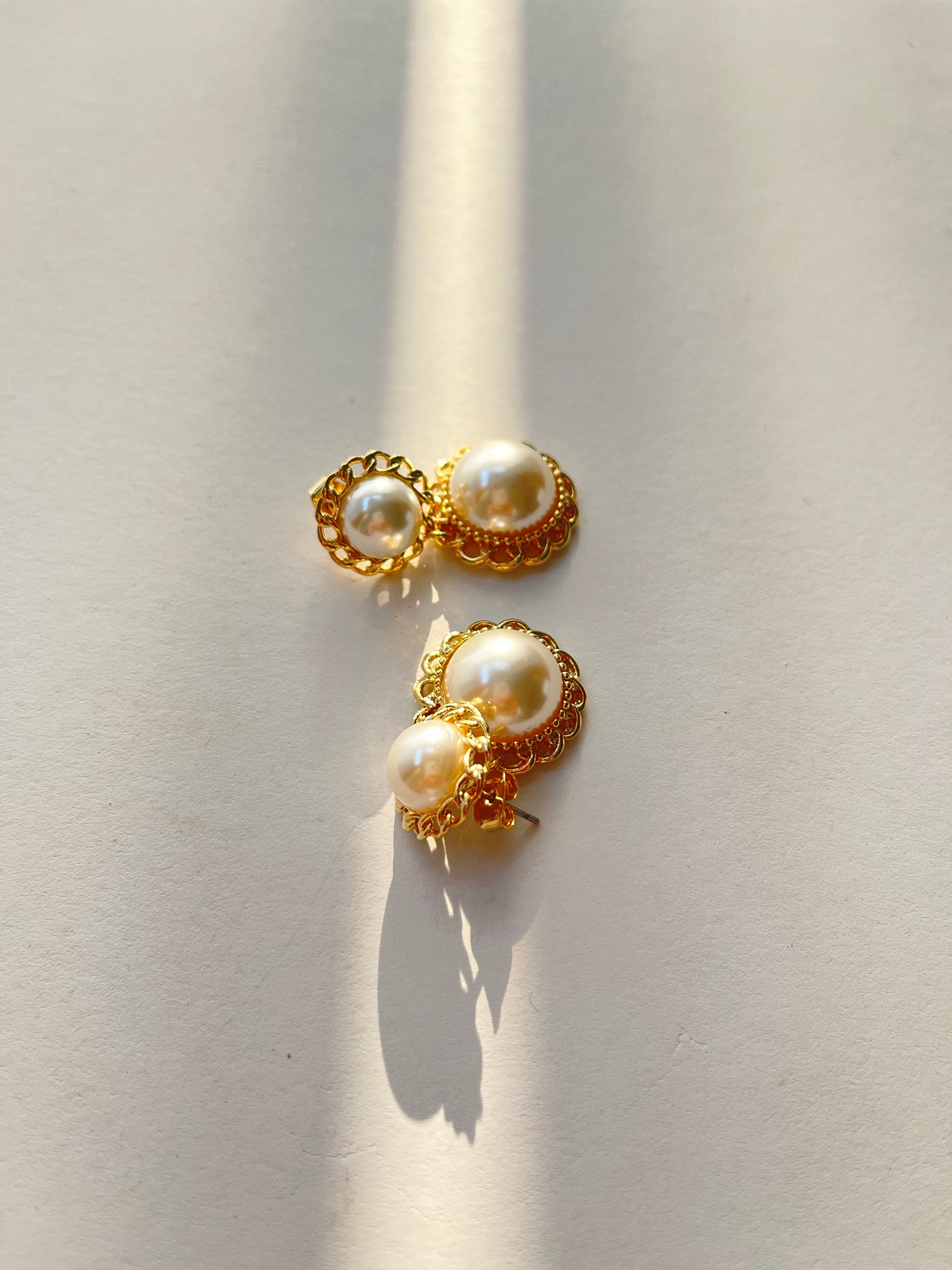 Presenting a captivating image showcasing the allure of Gold Pearl Earring, accentuated by Korean aesthetic outfits.