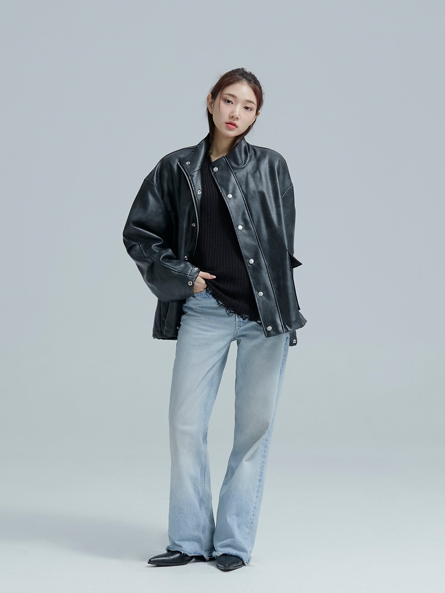 Model facing front, posing still while wearing the Lined leather jacket to show its korean street style.