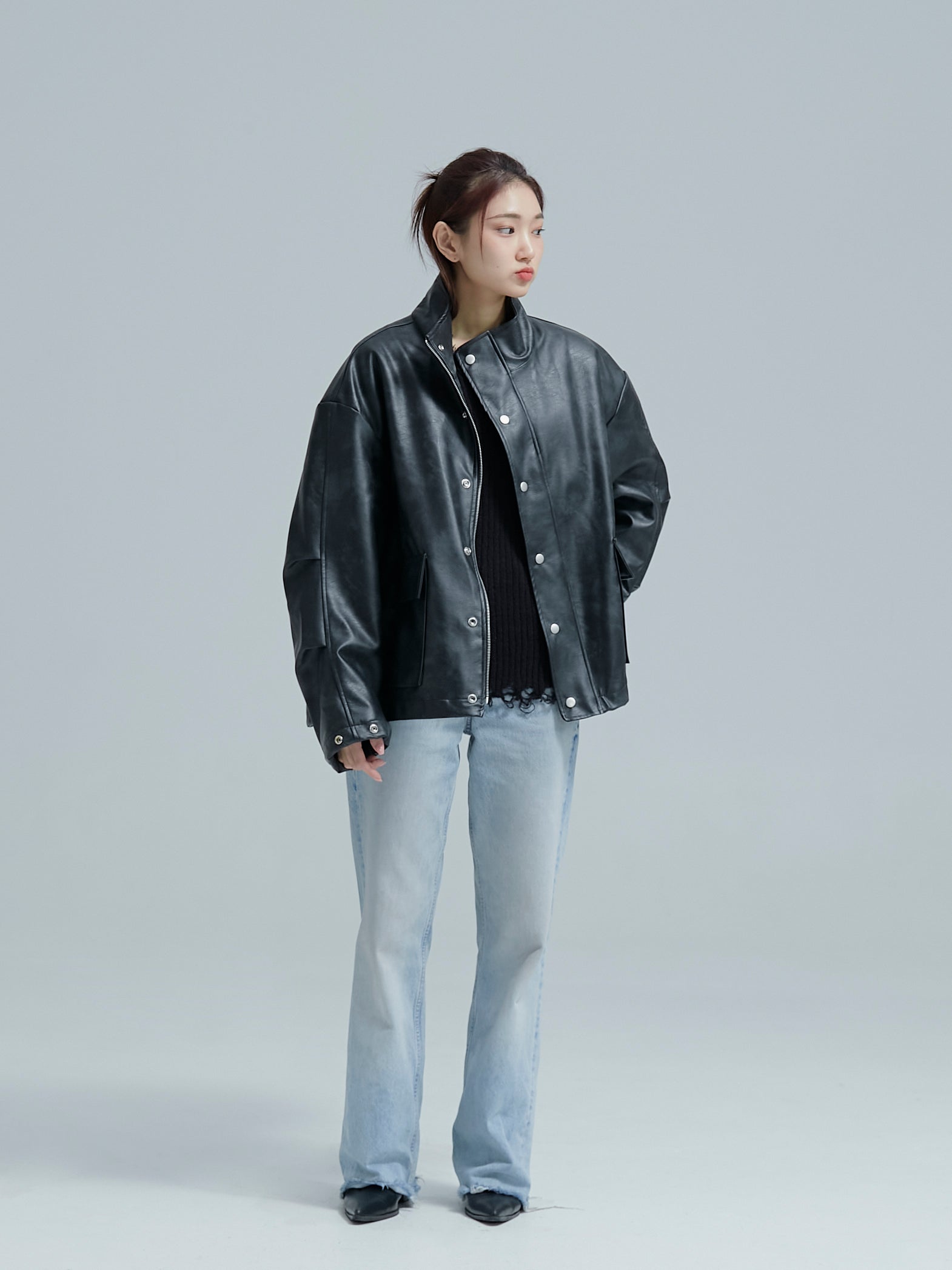 The model is glancing to the side while wearing the Lined leather jacket.