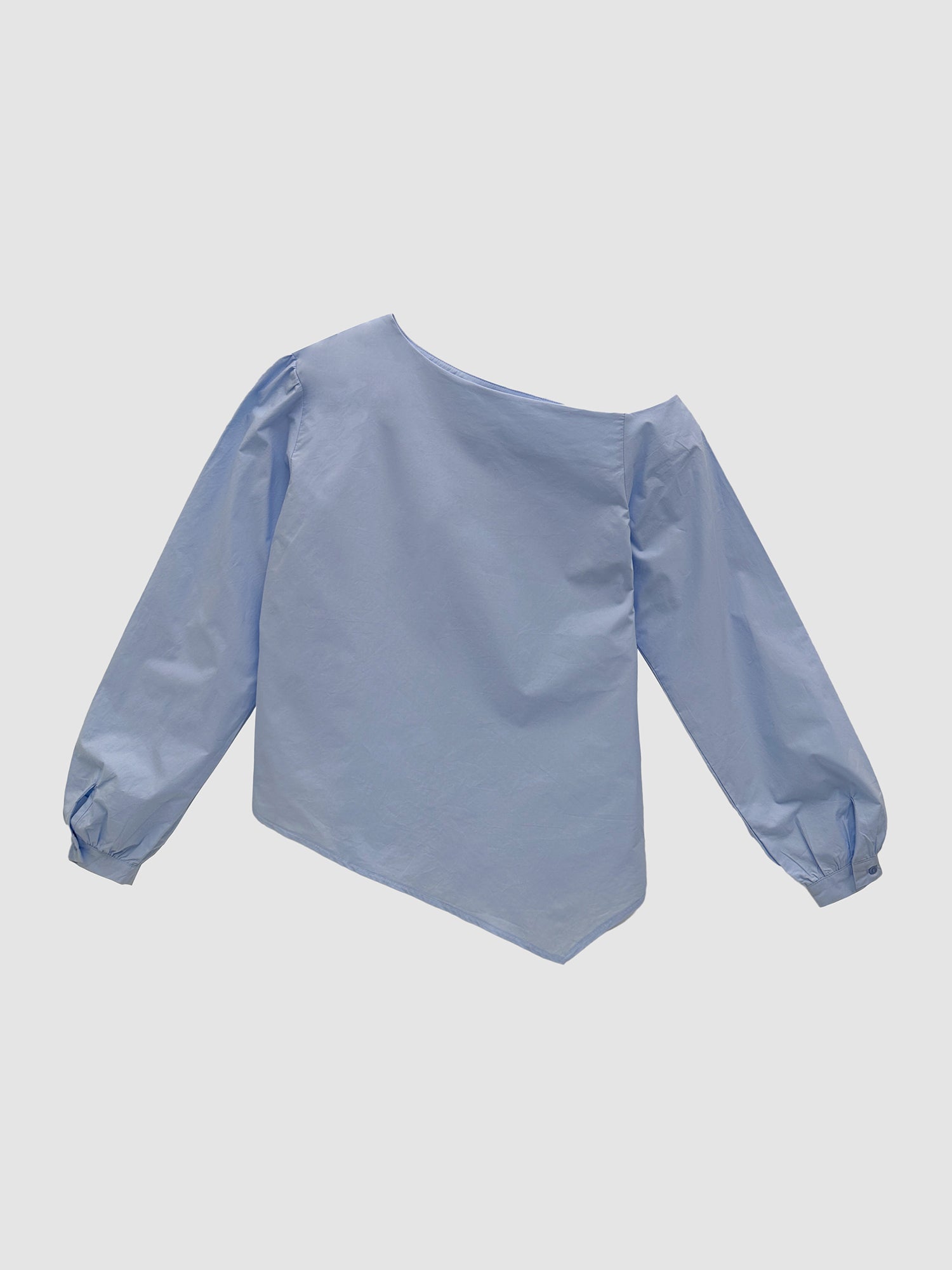 Provide a rear view of the light blue one-shoulder blouse to showcase the intricate back fit and design details.