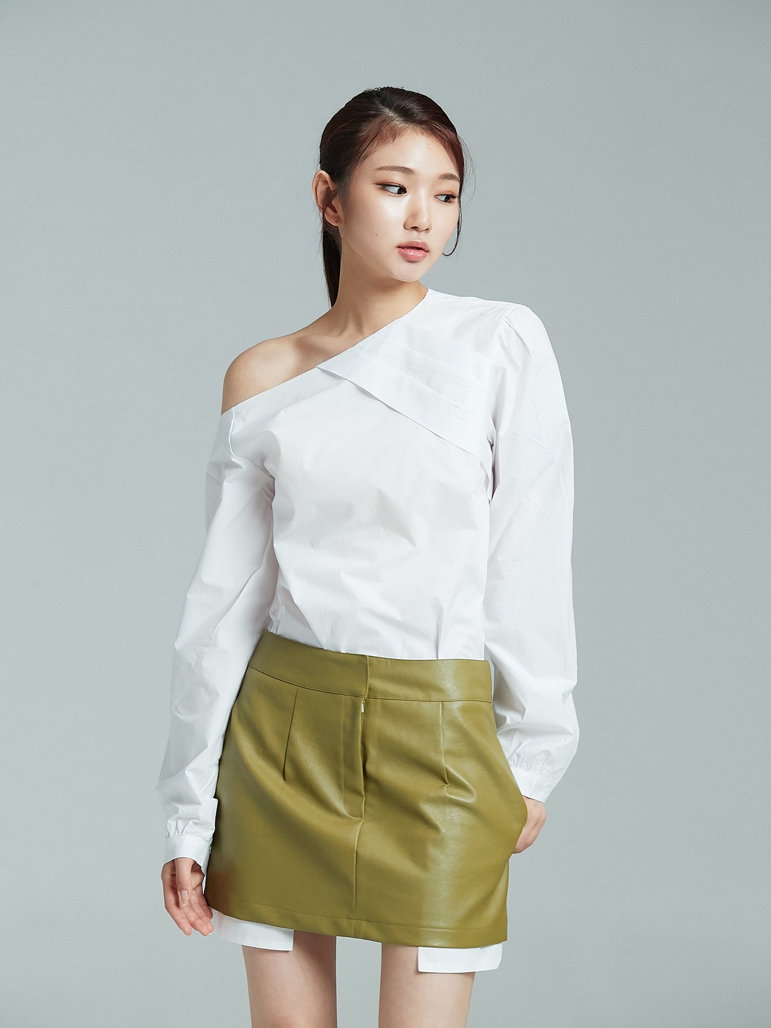 Front shot of the model wearing the one shoulder blouse showcasing the south korea fashion.