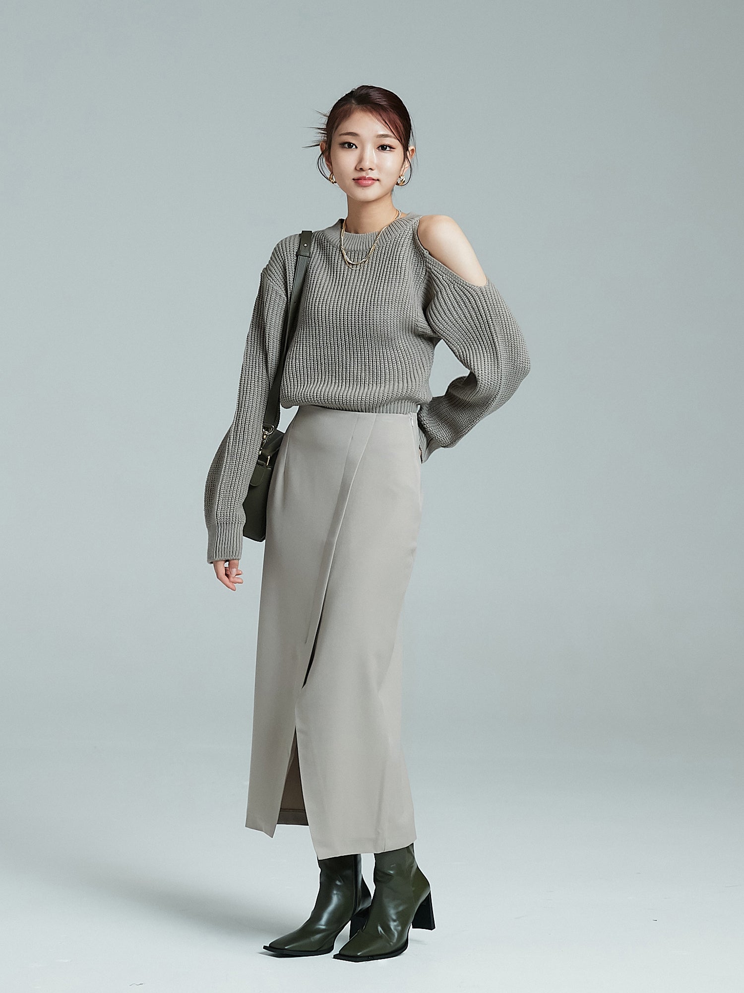 Capture the complete ensemble of the model, dressed in a overlap skirt, highlighting the style of Korean aesthetic outfits.