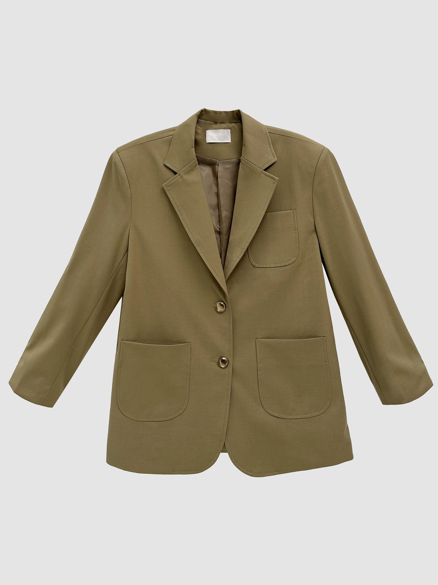 Product detailed view of the tan oversized pockets blazer accentuating its korean street style.