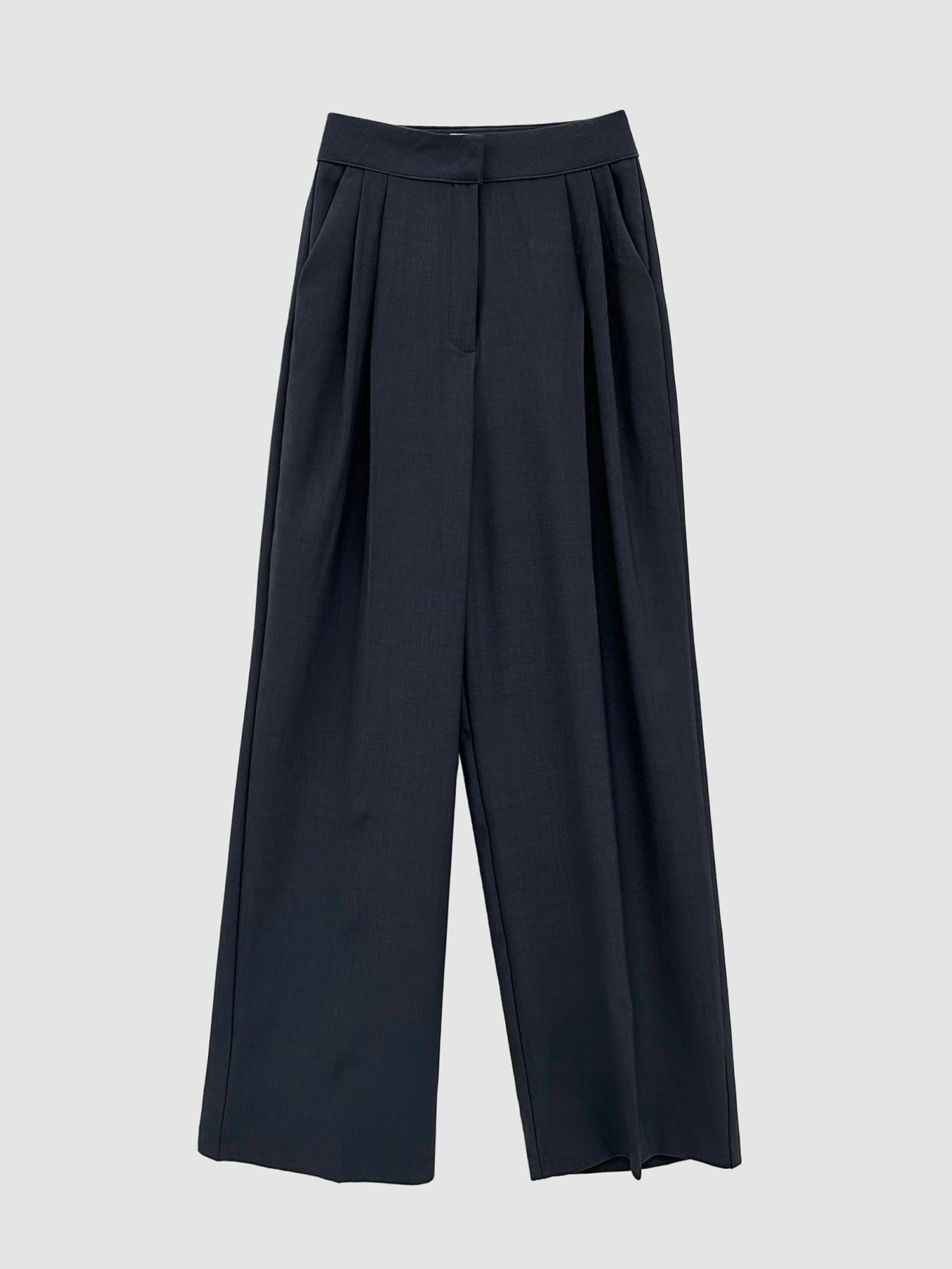 Present the front perspective of the pintuck wide-leg trousers to highlight the intricate design details on the garment.