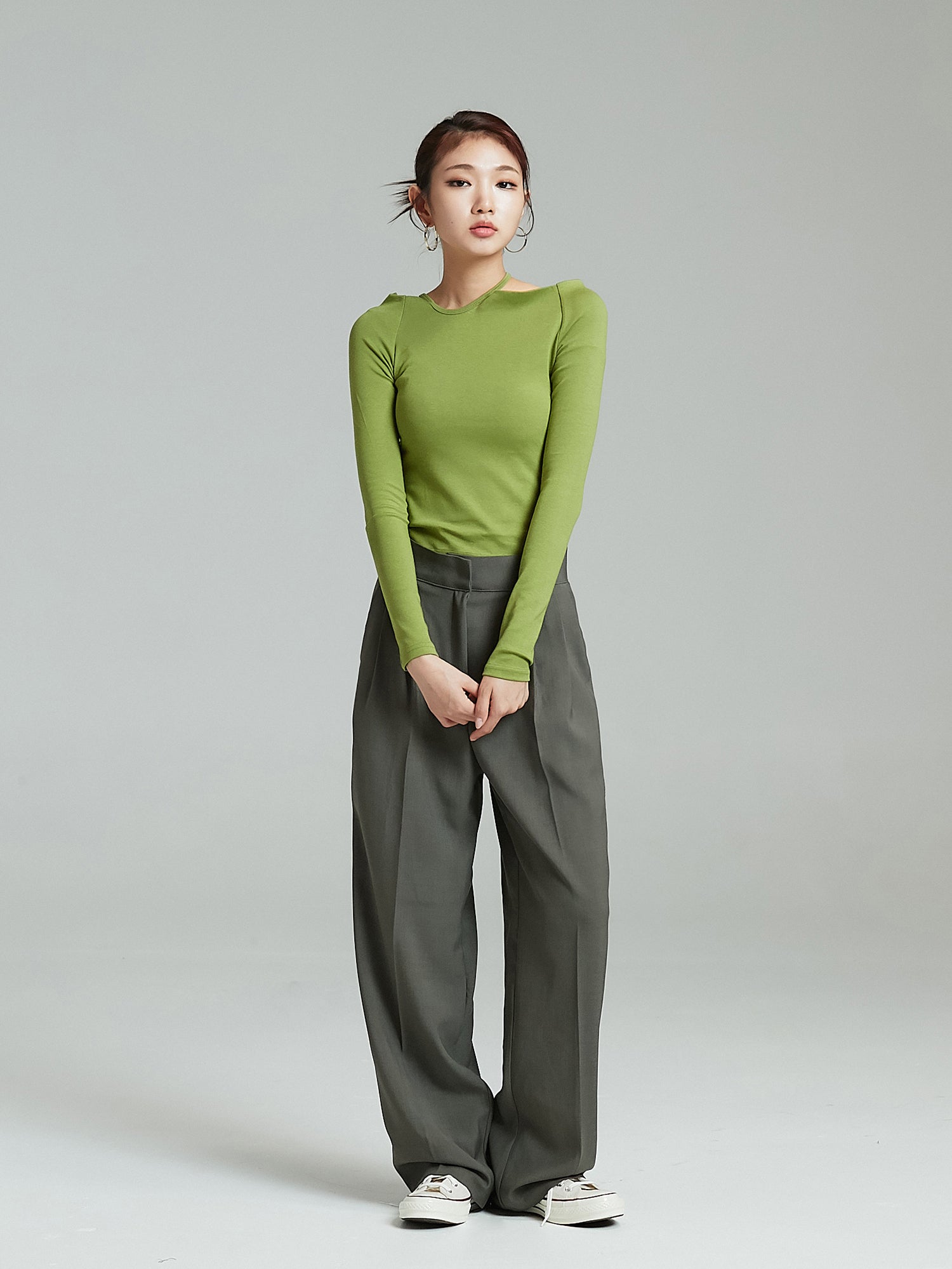 Full shot of the model wearing the Pintuck Wide Leg Trouser to showcase its korean street fashion look.