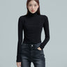 A frontal perspective of the model donning the black seamed turtleneck, spotlighting the essence of Korean street fashion.