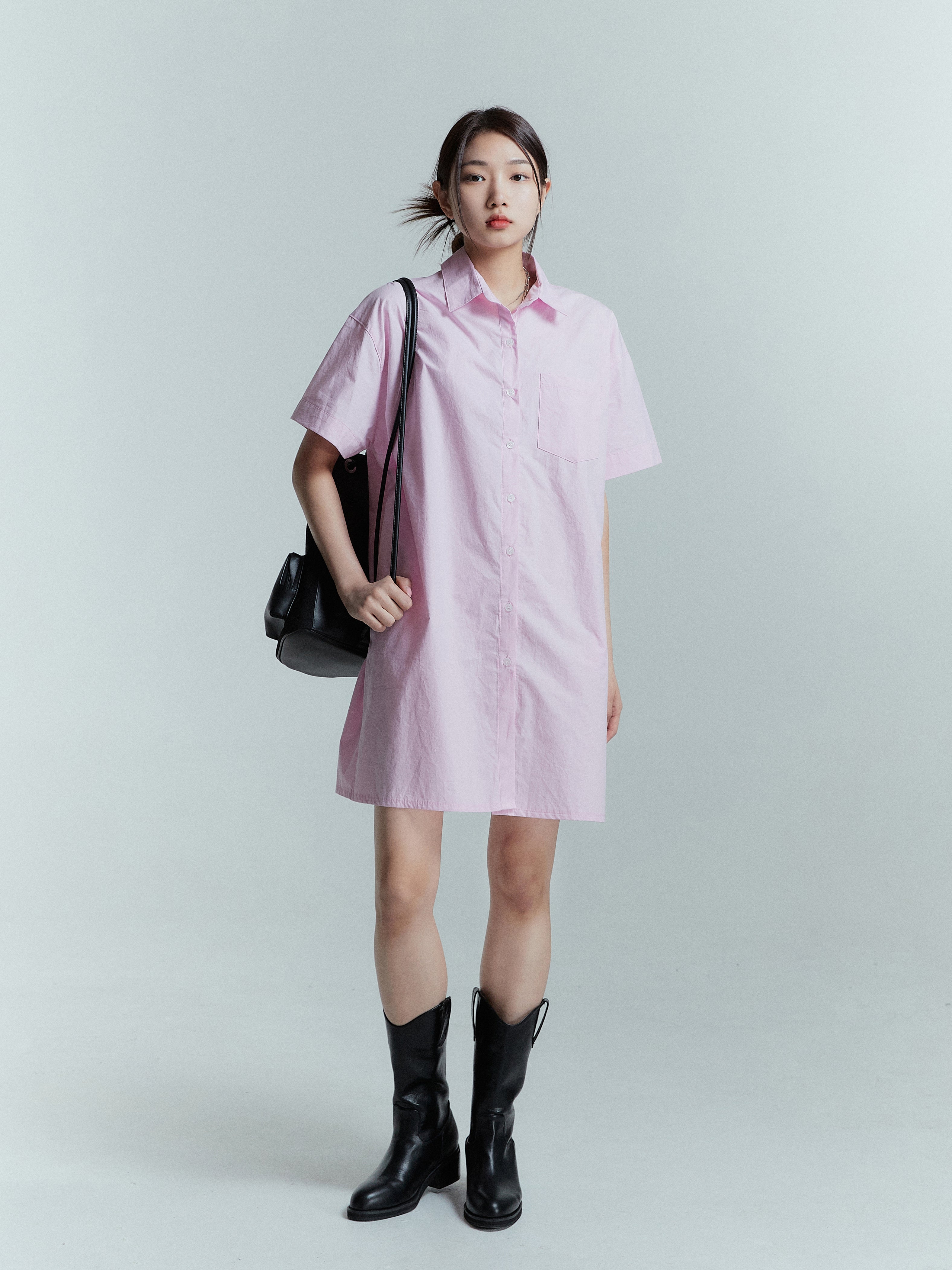 The full-length size of the pink shirt dress as the model confidently showcases it in a captivating full-length shot.