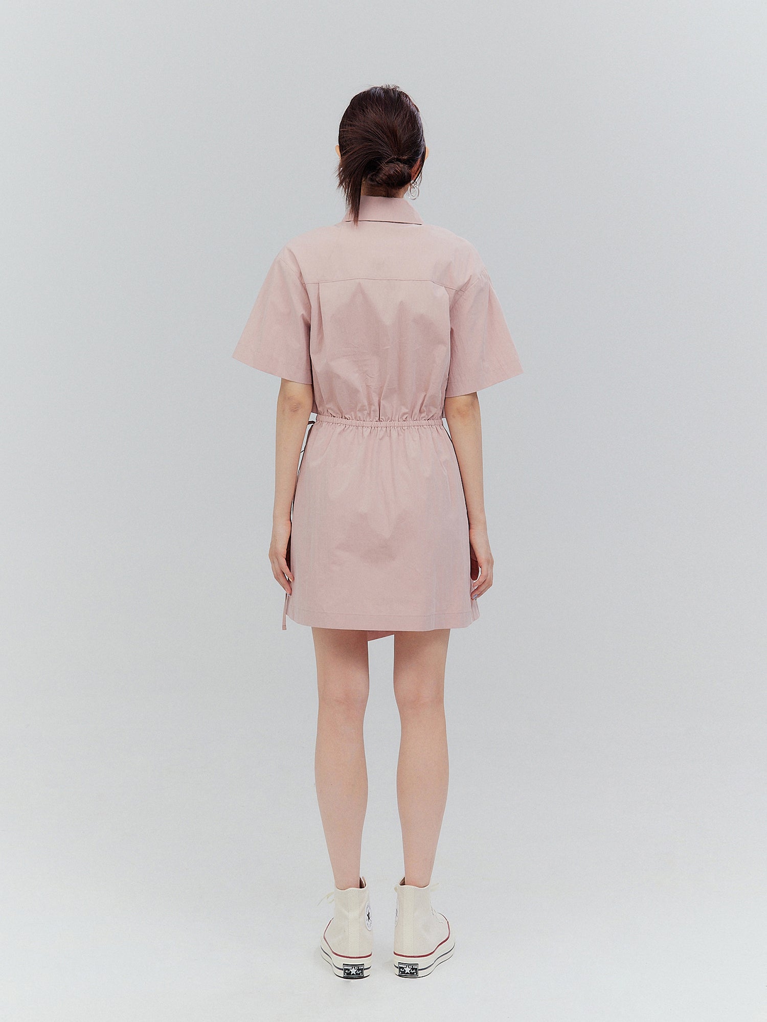 Explore the beauty of Korean aesthetic outfits from a different perspective with a stunning back view of the model wearing the pink shirt dress.