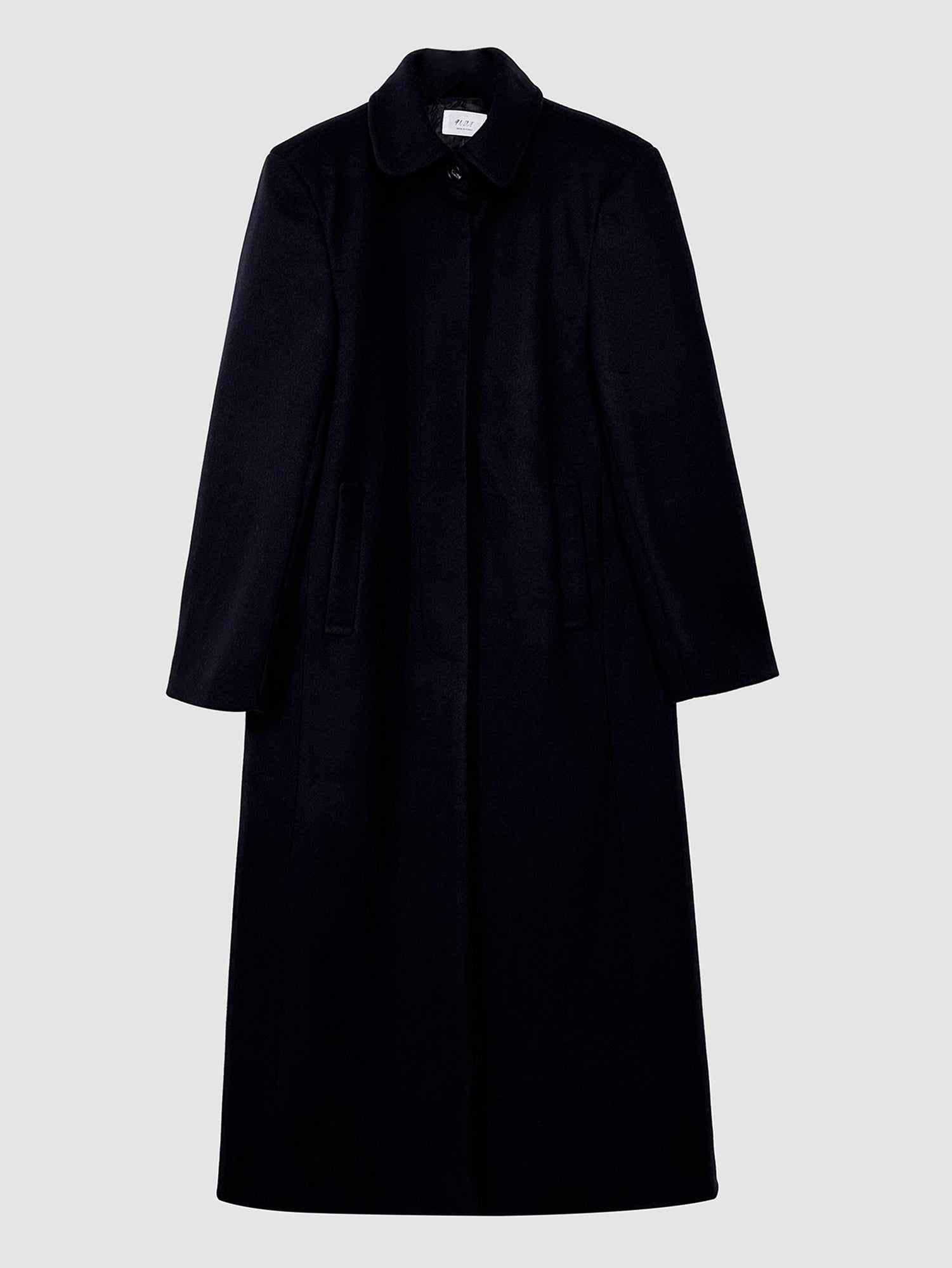 Frontal detailed view of the dark navy single-breasted overcoat, exuding the sophistication and charm of Korean aesthetic outfits.