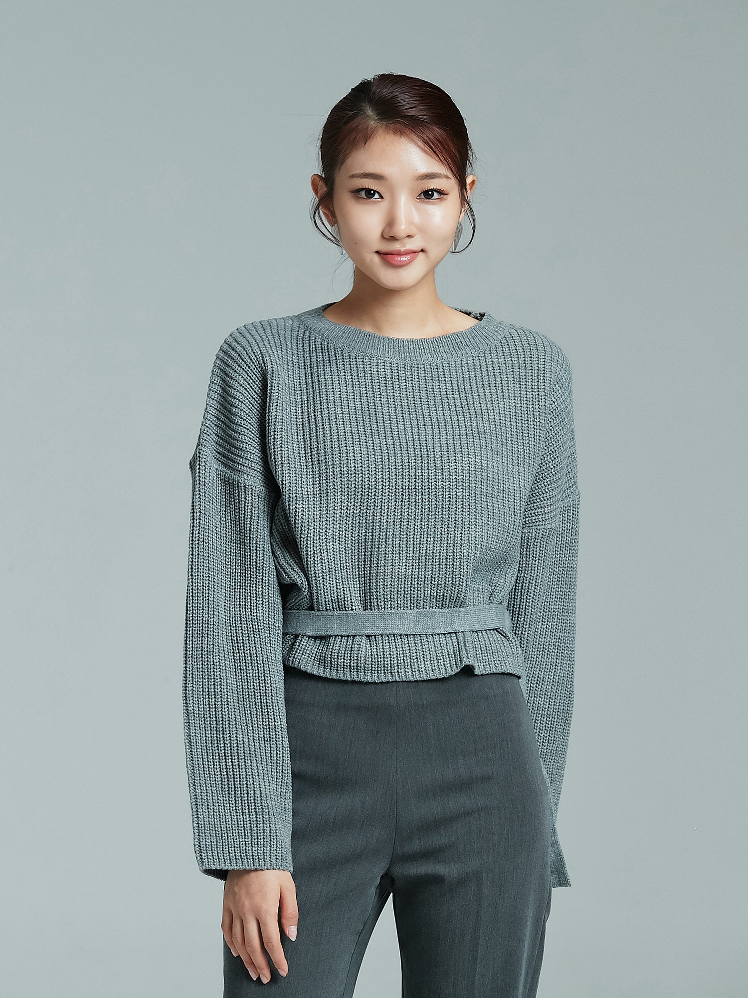 Front shot of the model wearing the sloane sweater showing the intricate details of the sweater.