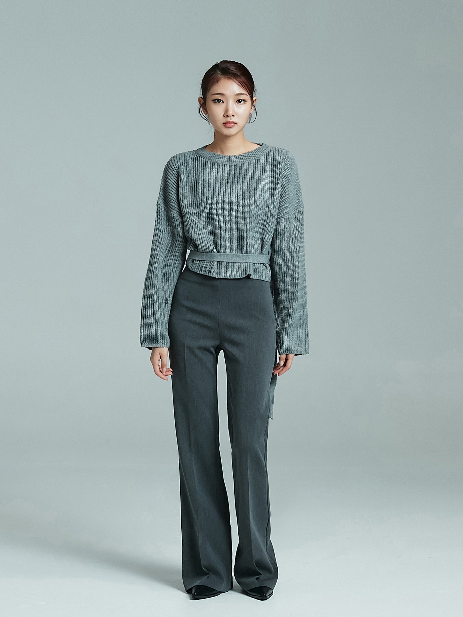 Full-shot of the model standing straight, wearing the sloane sweater showcasing the korean aesthetic outfits look.