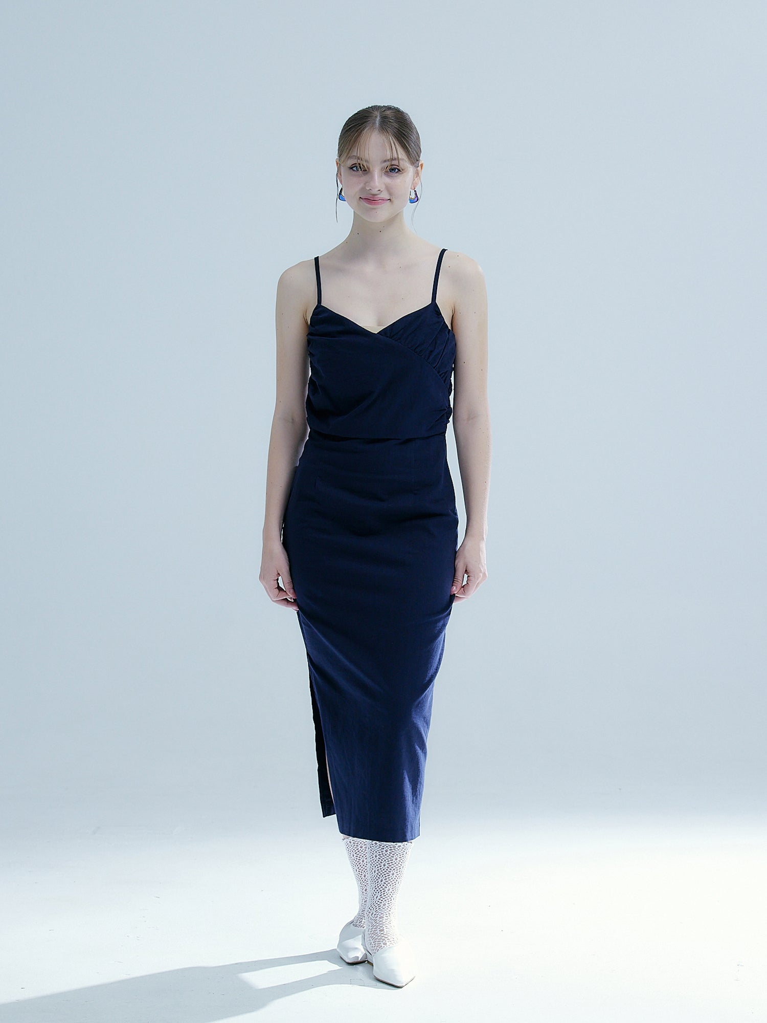 Front shot of the model wearing the navy smocked elastic dress.