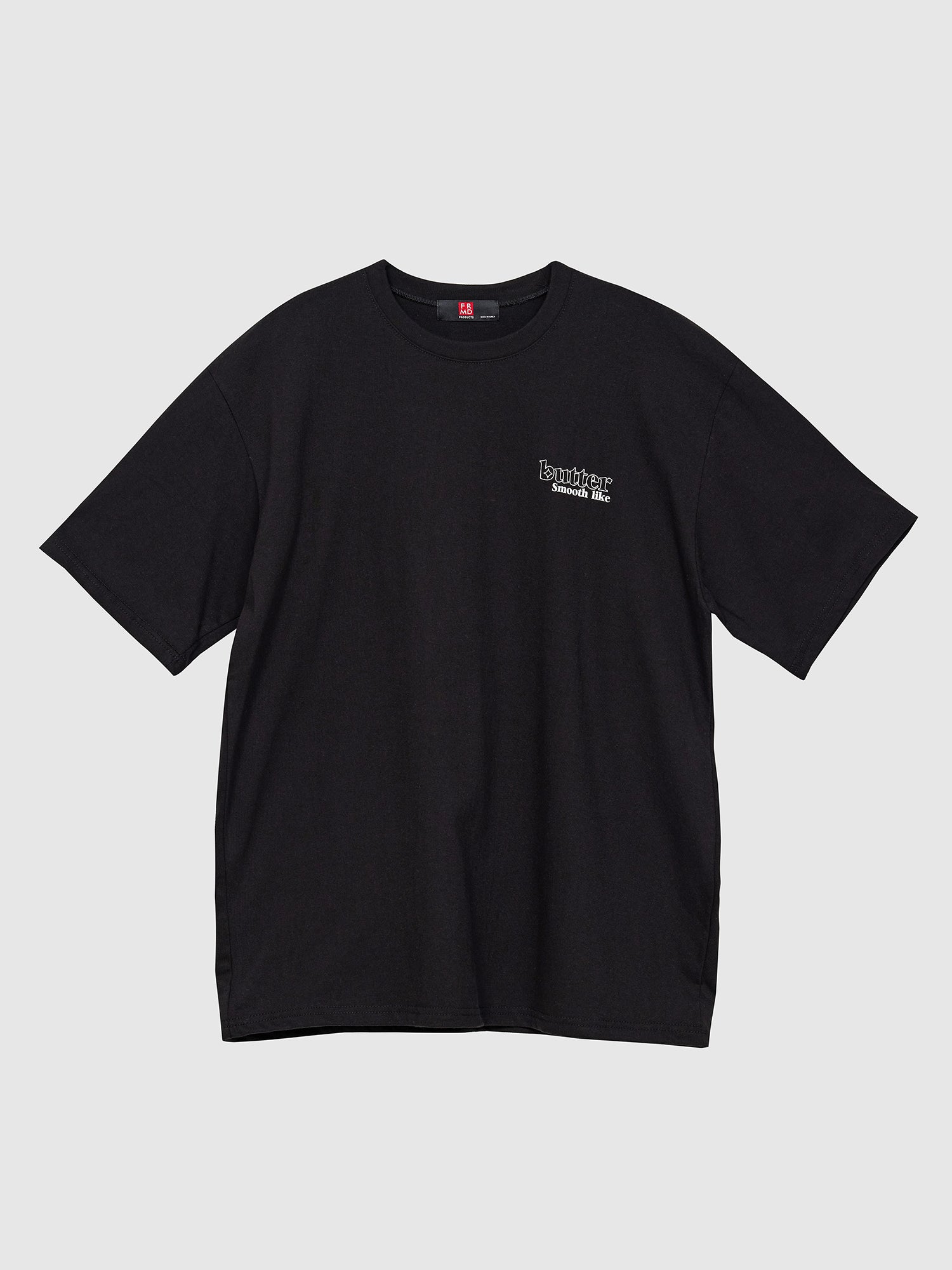 A product detailed view of the black 'Smooth Like Butter' T-shirt, set against a gray backdrop, oozing in Korean street fashion with its captivating design and style.