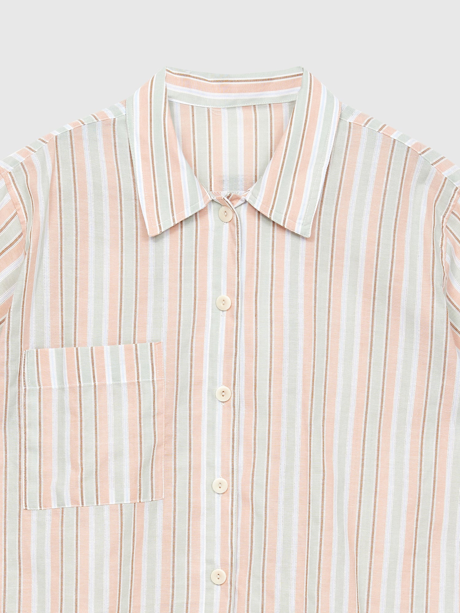 A close-up view of the stripe print shirt showing the intricate design details of the shirt collar and the fabric materials.