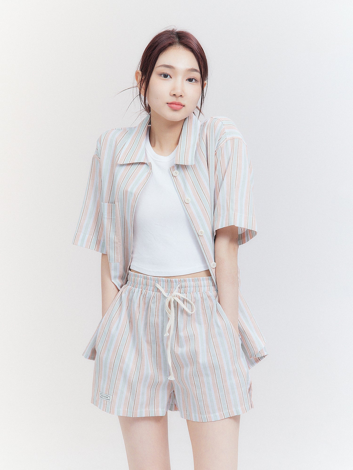 A full-shot of the model wearing the South Korea fashion inspired Striped Print Shirt, showcasing its trendy and fashionable appeal.