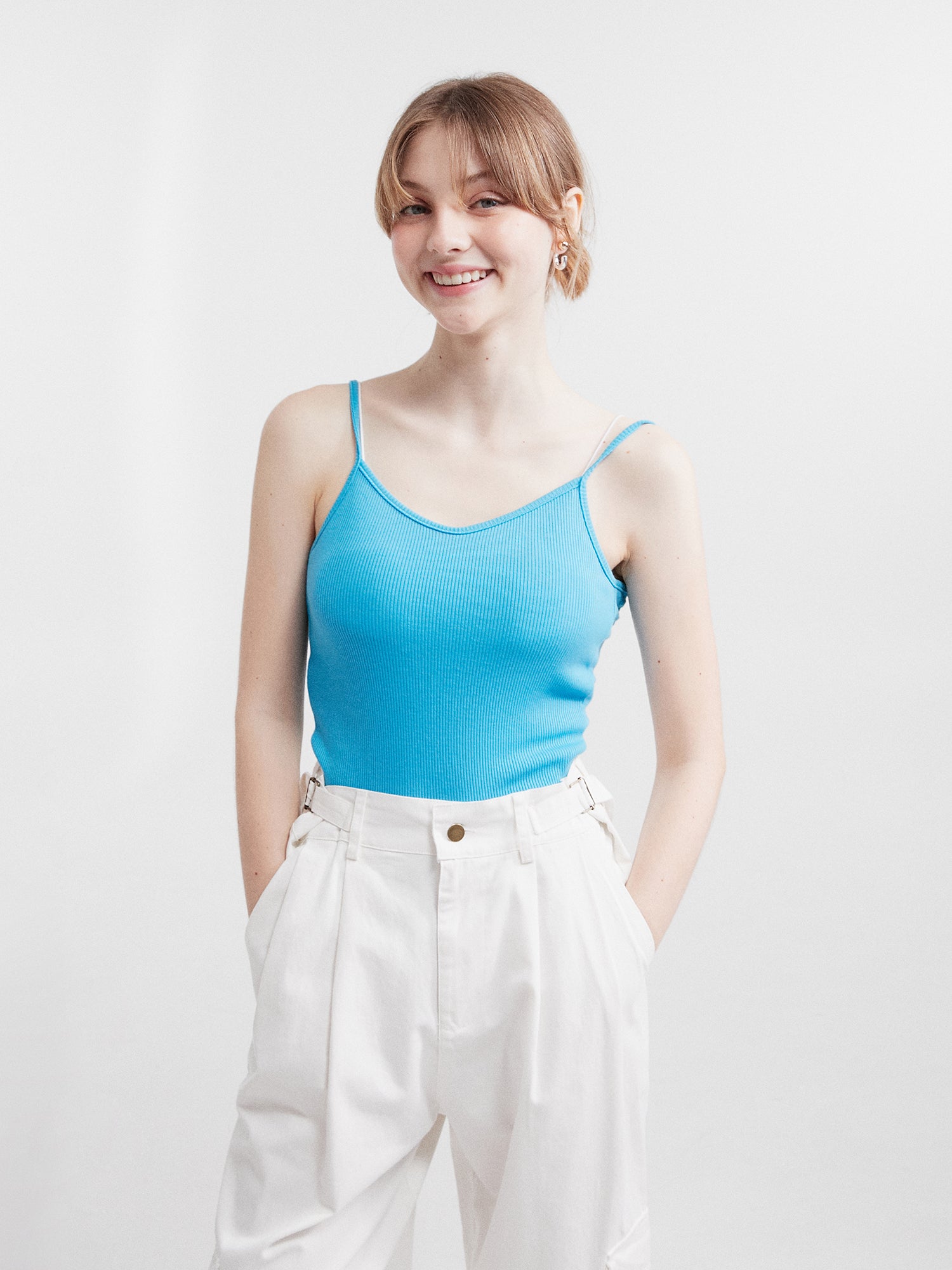 Front model shot showcasing Korean street fashion with a stylish twist, featuring a blue tank top.