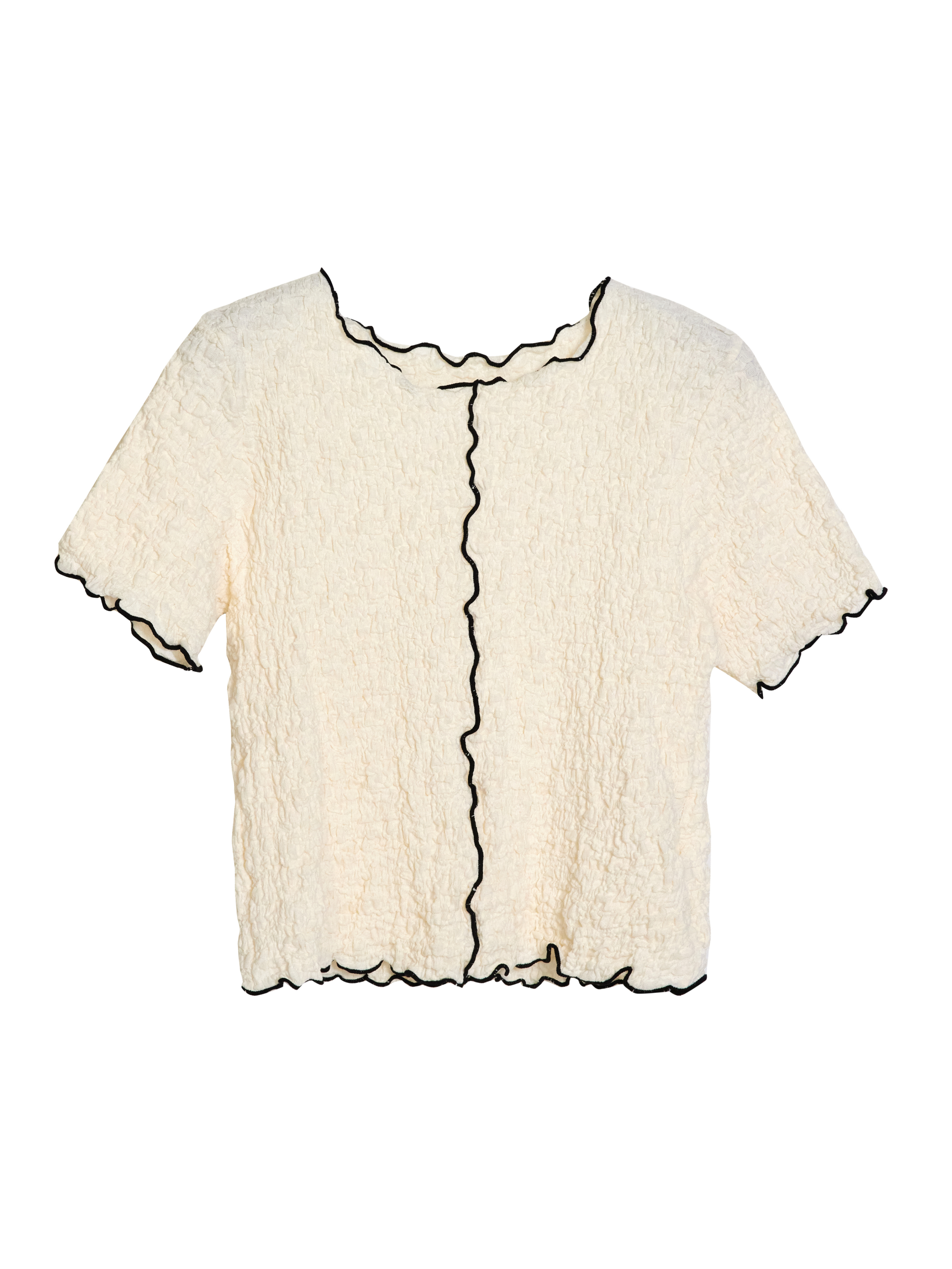 Front view of the cream textured top showcasing the intricate contrast design of the top.