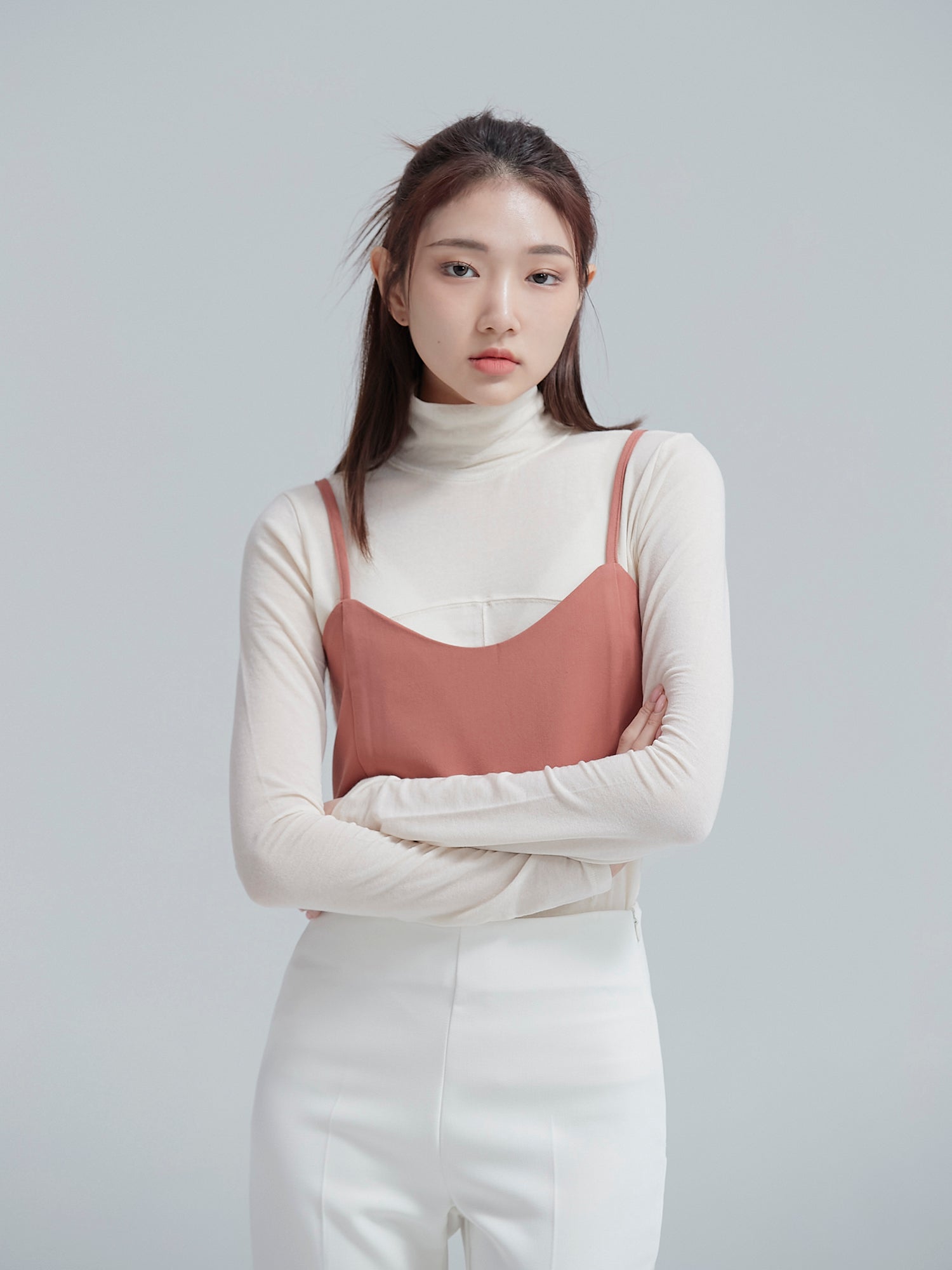 A close-up view of the model wearing the two ways tie cropped top to highlight its design detail of the top.