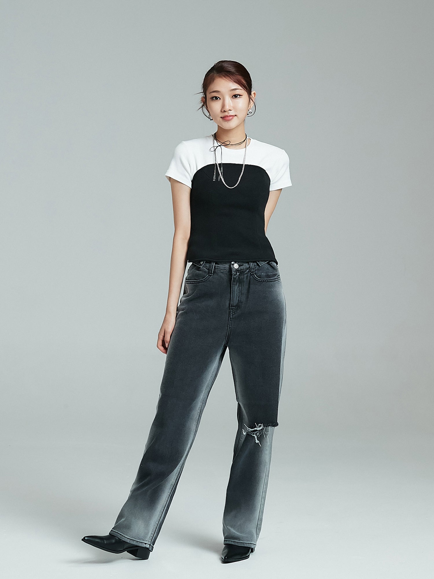 Capture the model's front view in Washed Rip Jeans, striking a pose to highlight the Korean street fashion essence.