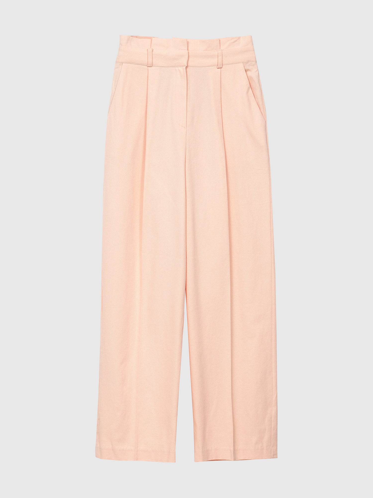 Product detailed view of the light pink belted pleated pants showcasing the front details of the pants.