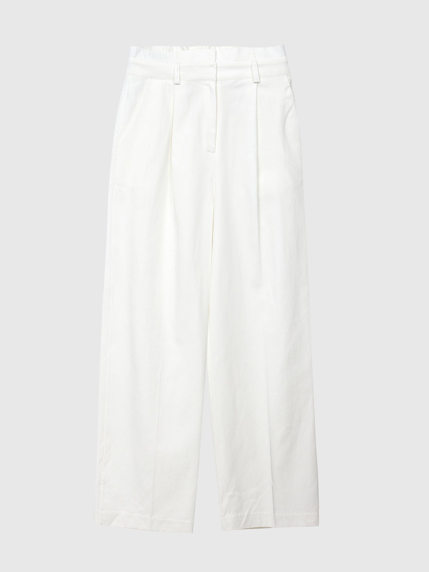 Product detailed view of the white belted pleated pants with gray backdrop.