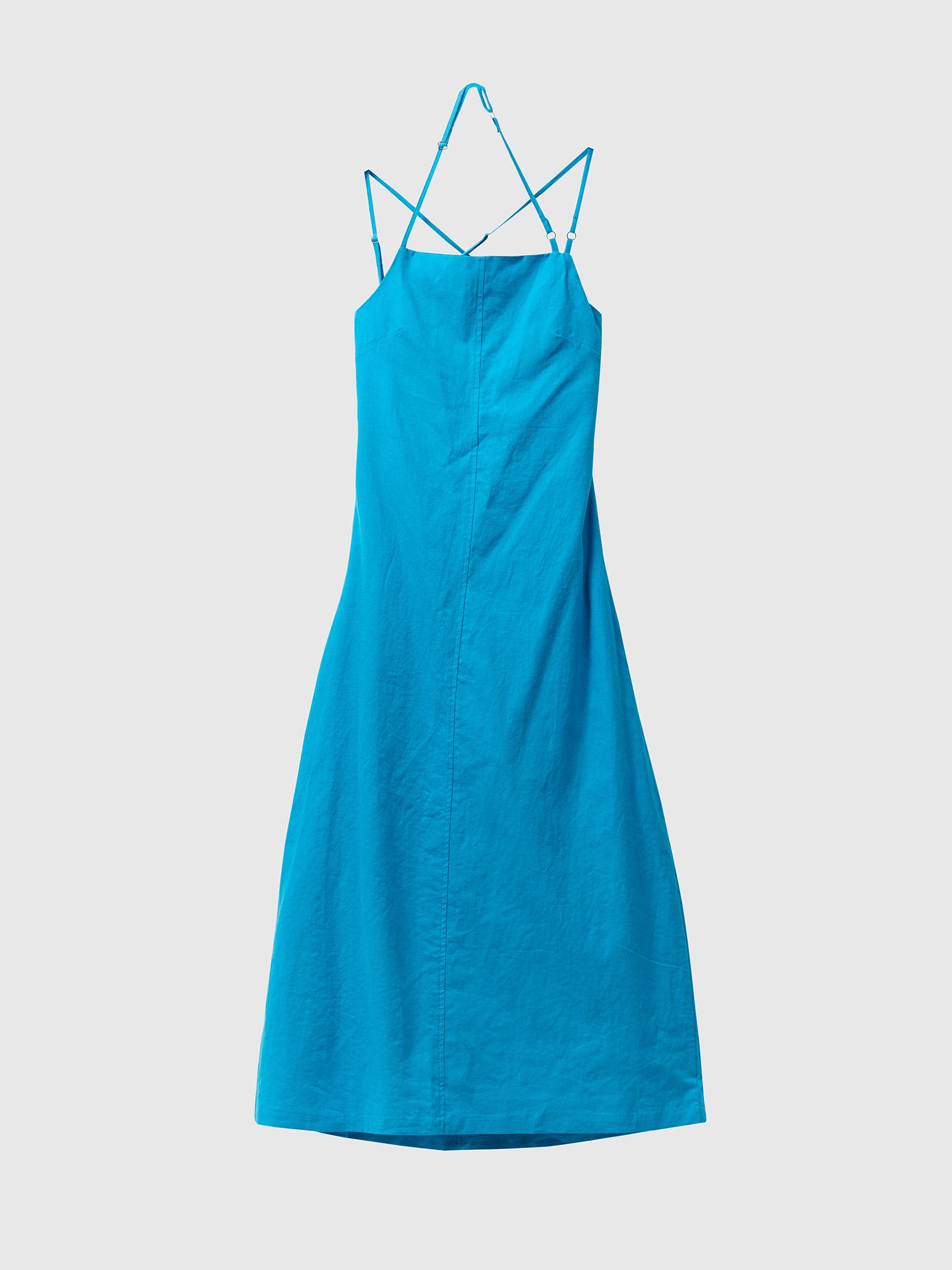 Product detailed view of the blue backless midi dress with white backdrop.