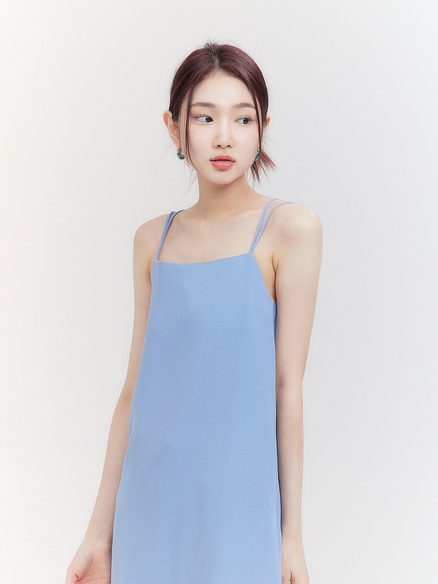 A close-up show of the light blue cami dress showing the front design of the dress.