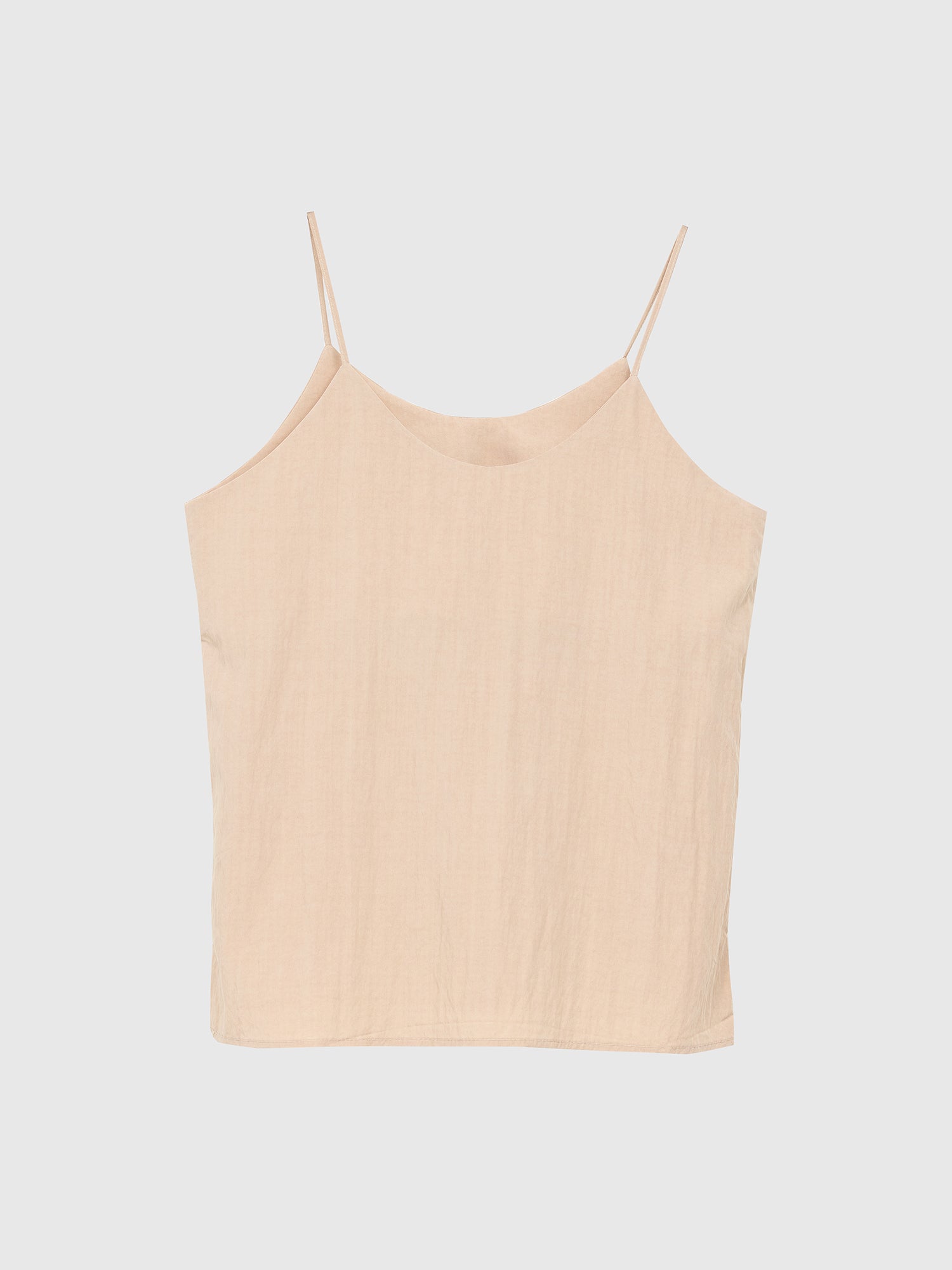 A front view of the beige cami top, showcasing its front design and embodying contemporary fashion.