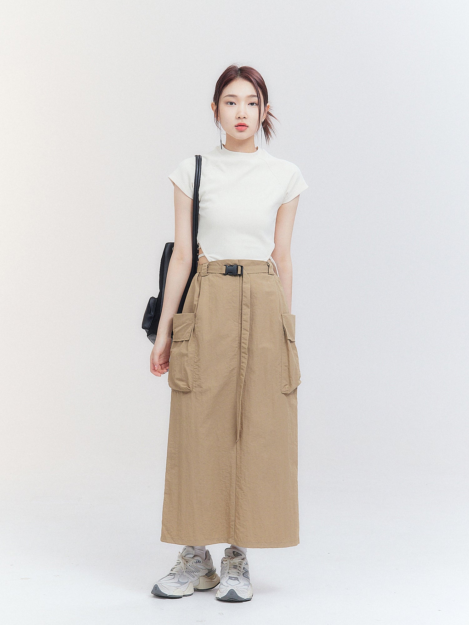 The front view captures the model donning a cargo midi skirt, epitomizing the essence of Korean street fashion with style and flair.