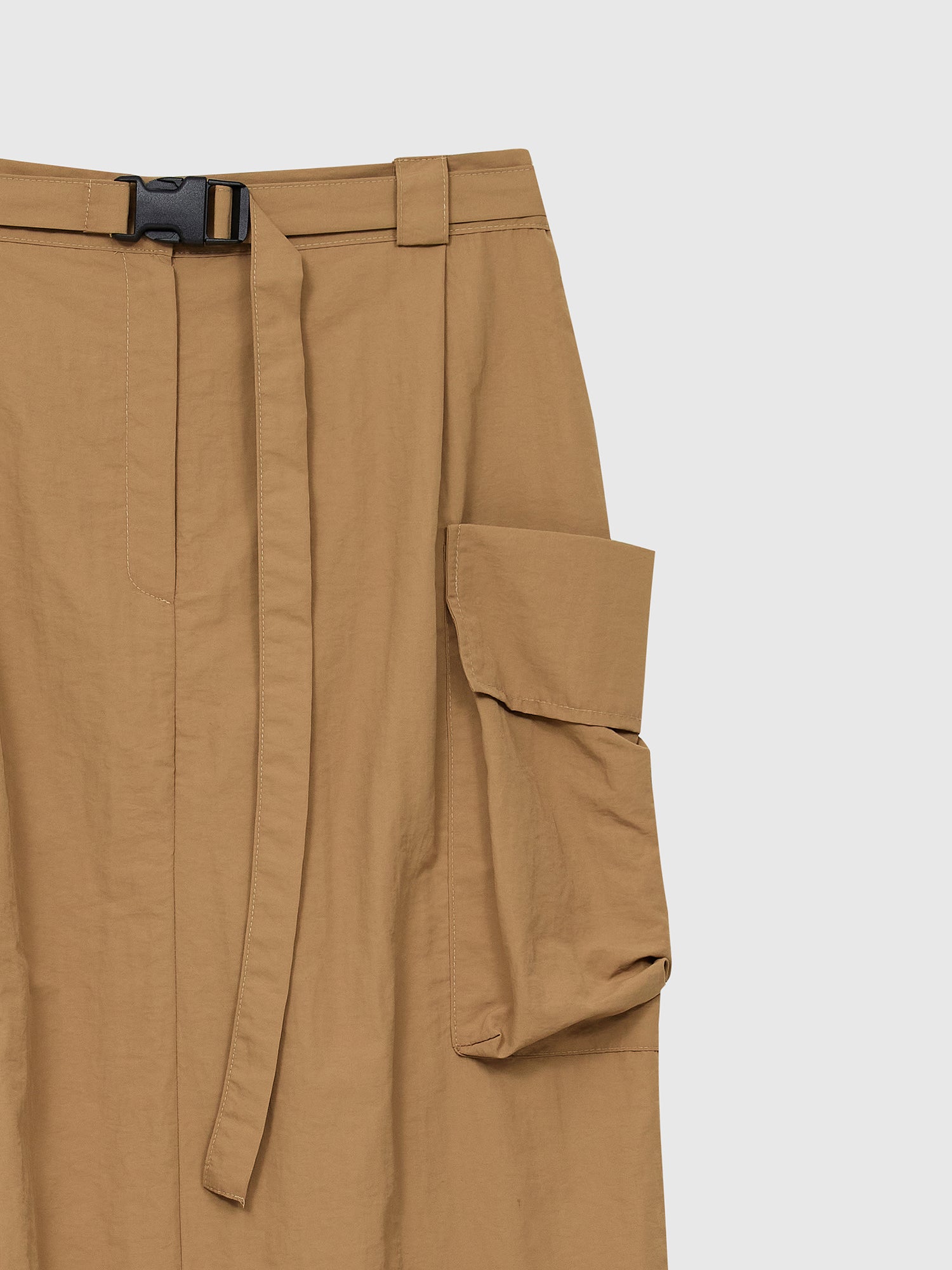 A zoomed-in view of the cargo skirt focusing on the pocket and belted detail of the skirt.