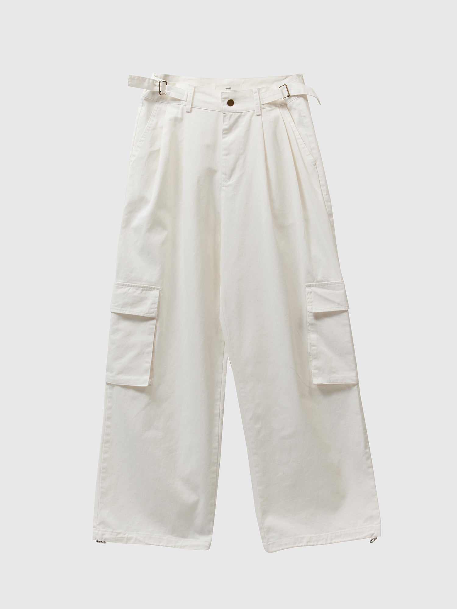 Product detailed shot of the Ivory cargo pants showcasing the front details of the design.