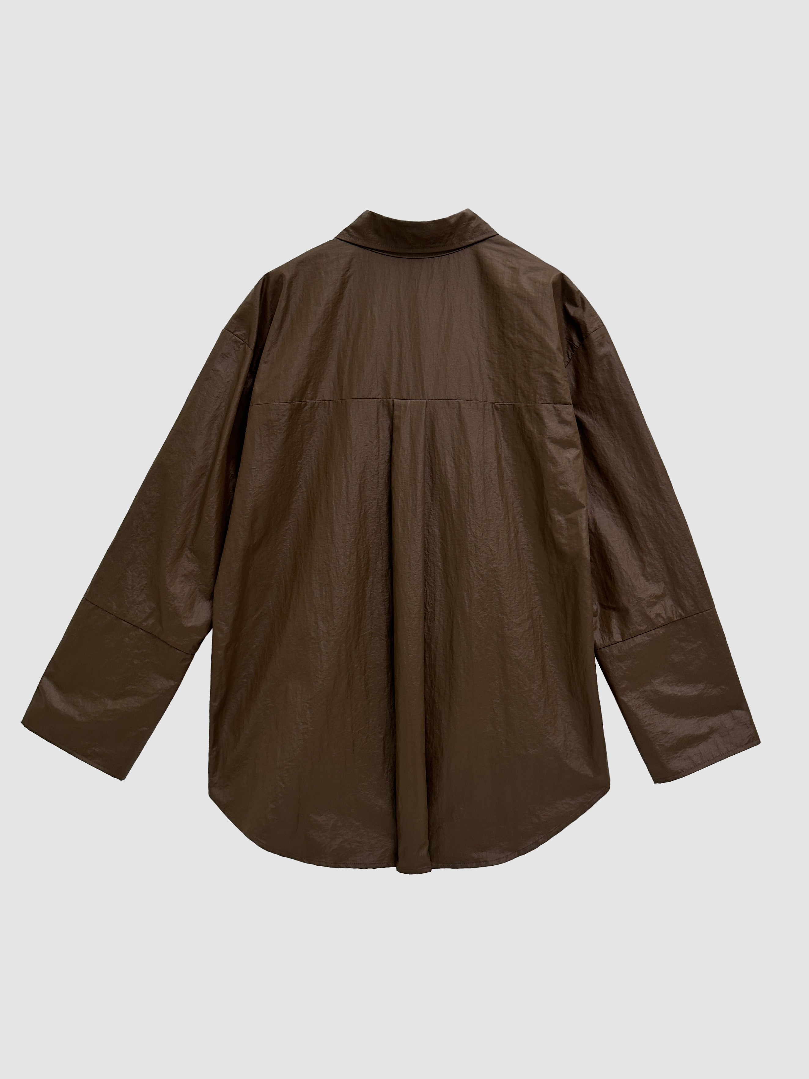 Back detailed view of the brown coated shirt with pockets showing its back design detail.