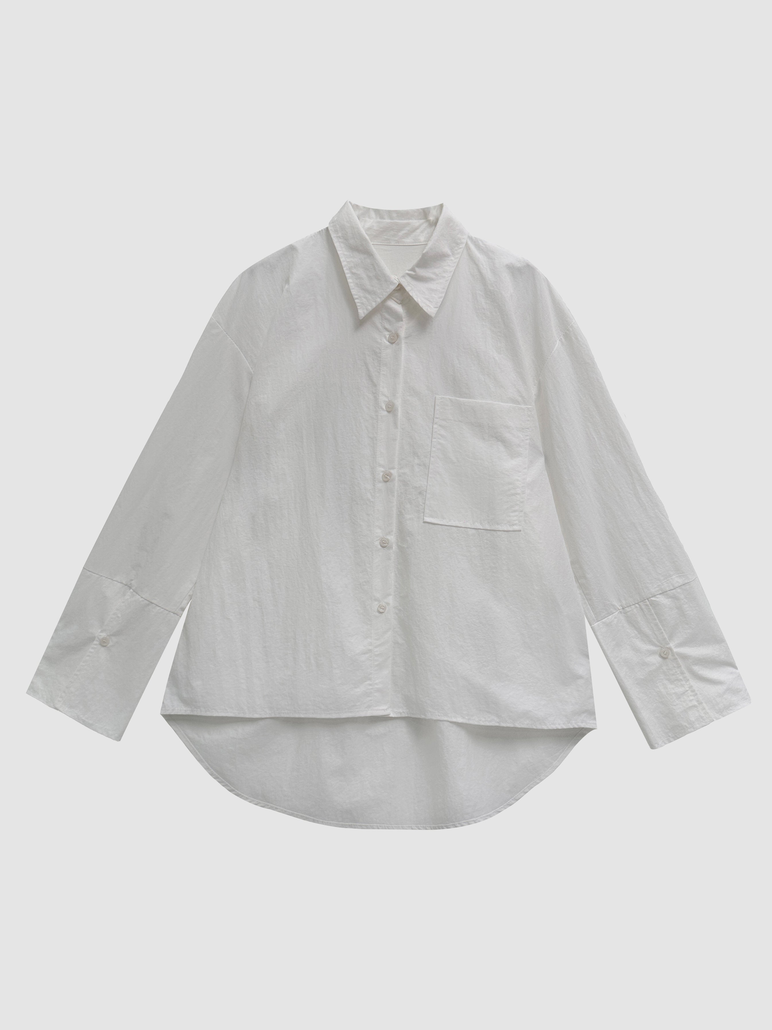 Product detailed view of the white coated shirt with pockets with white backdrop.