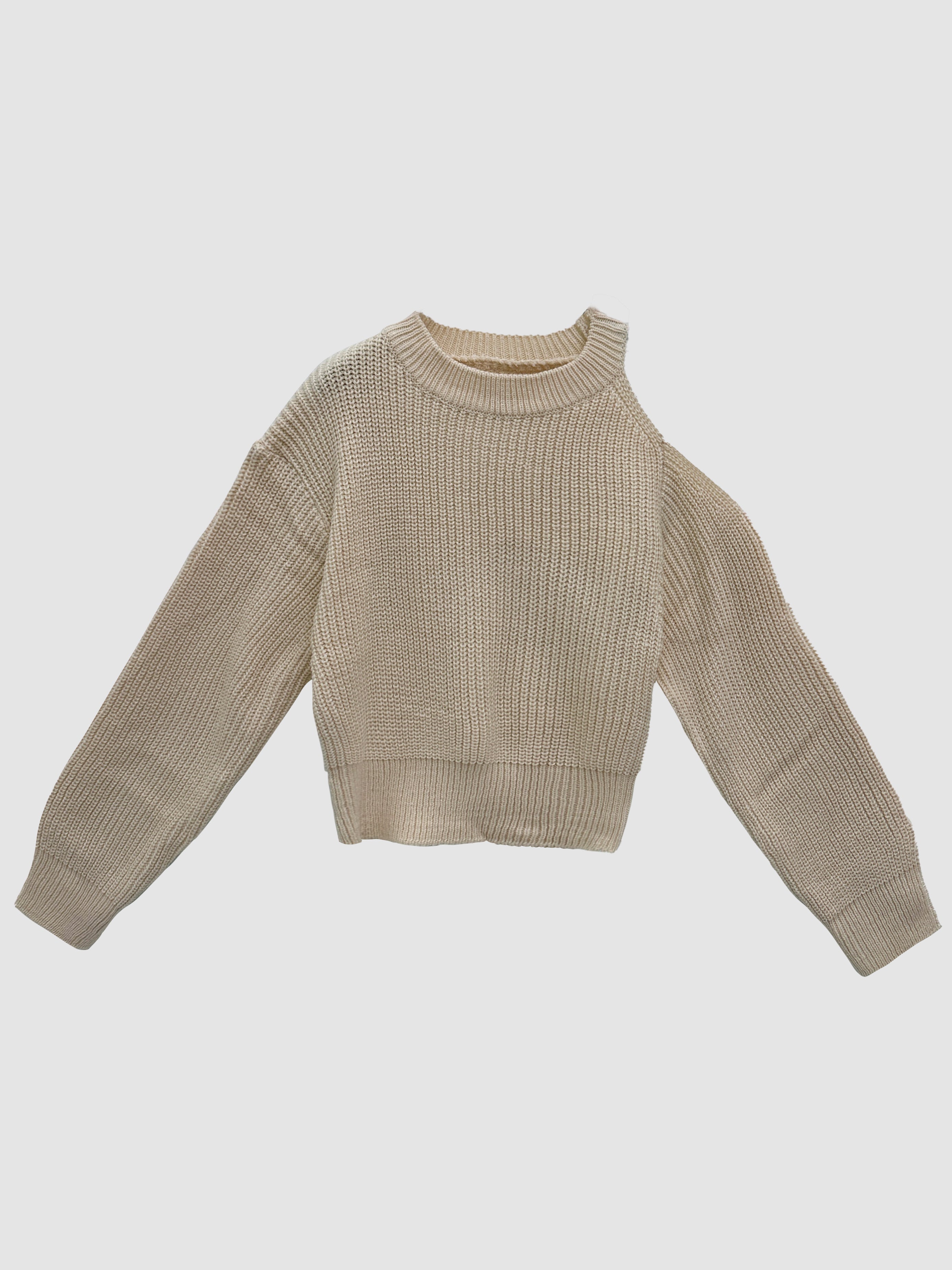 Product detailed shot of the beige cold shoulder sweater with white backdrop.