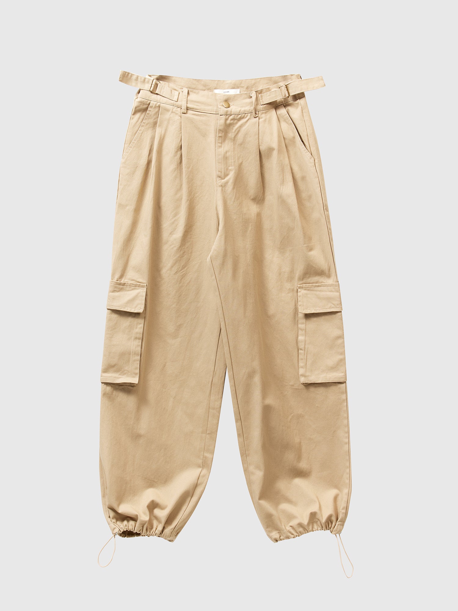 Front shot of the light beige cargo pants showcasing the adjustable cuff ankle design of the pants.