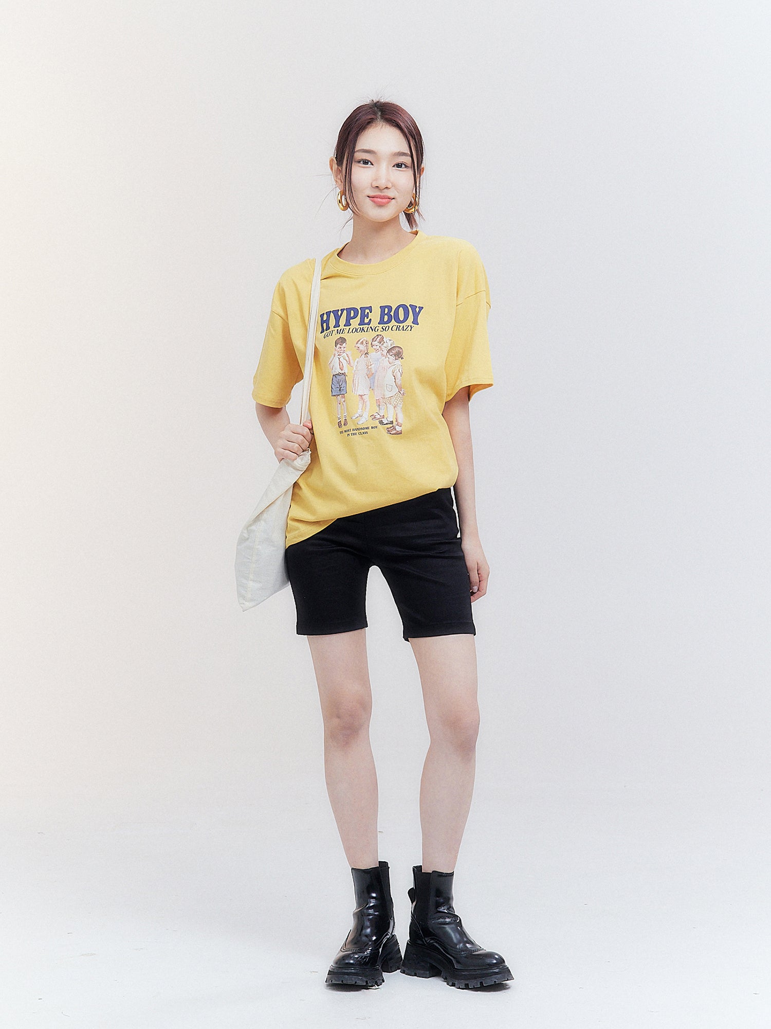 A full-length shot presents the model in Hype Boy T-shirt, striking a pose that exemplifies korean street fashion.