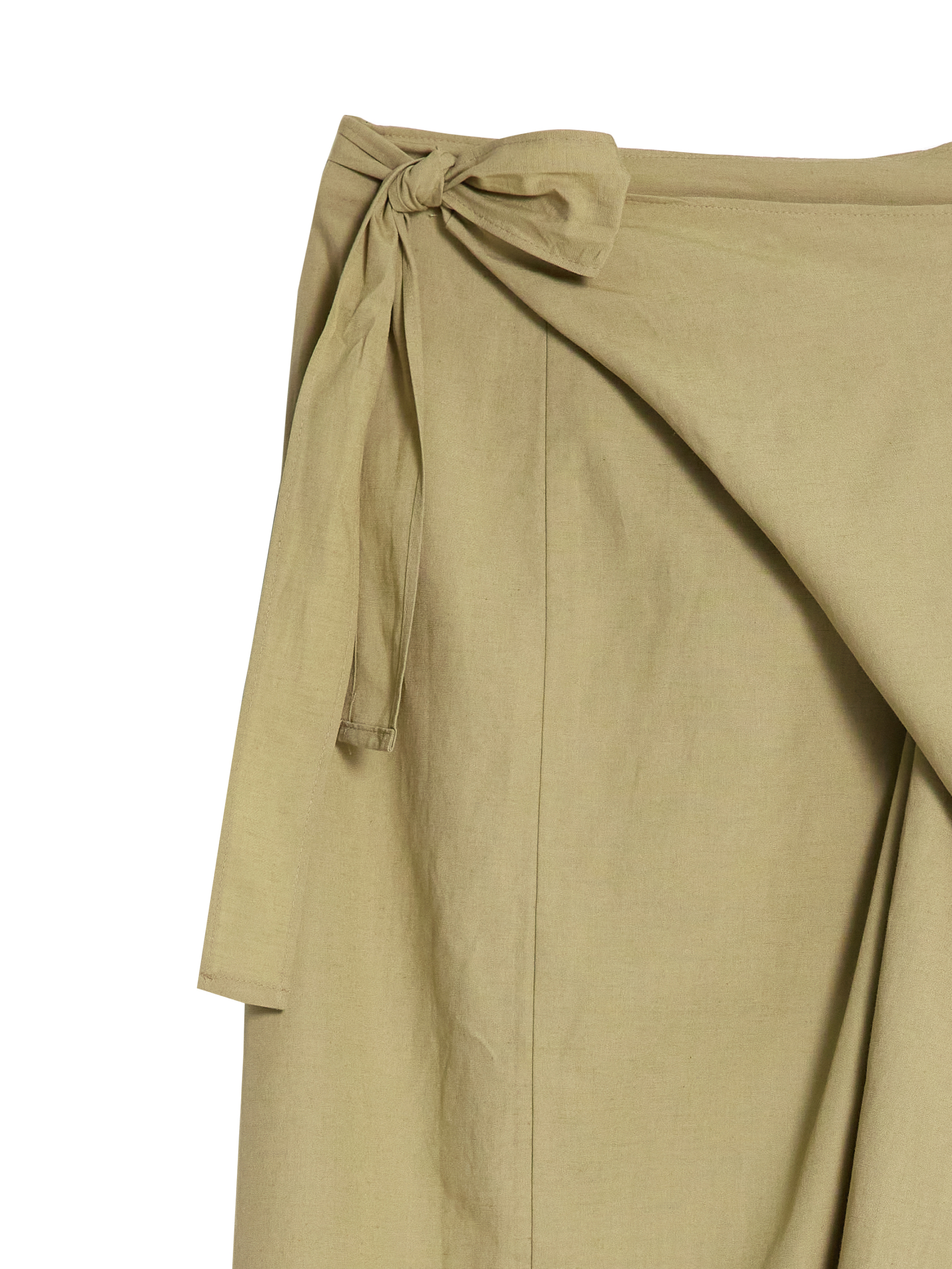 Product detailed close-up of a wrap midi skirt focusing on the wrap detail of the skirt.