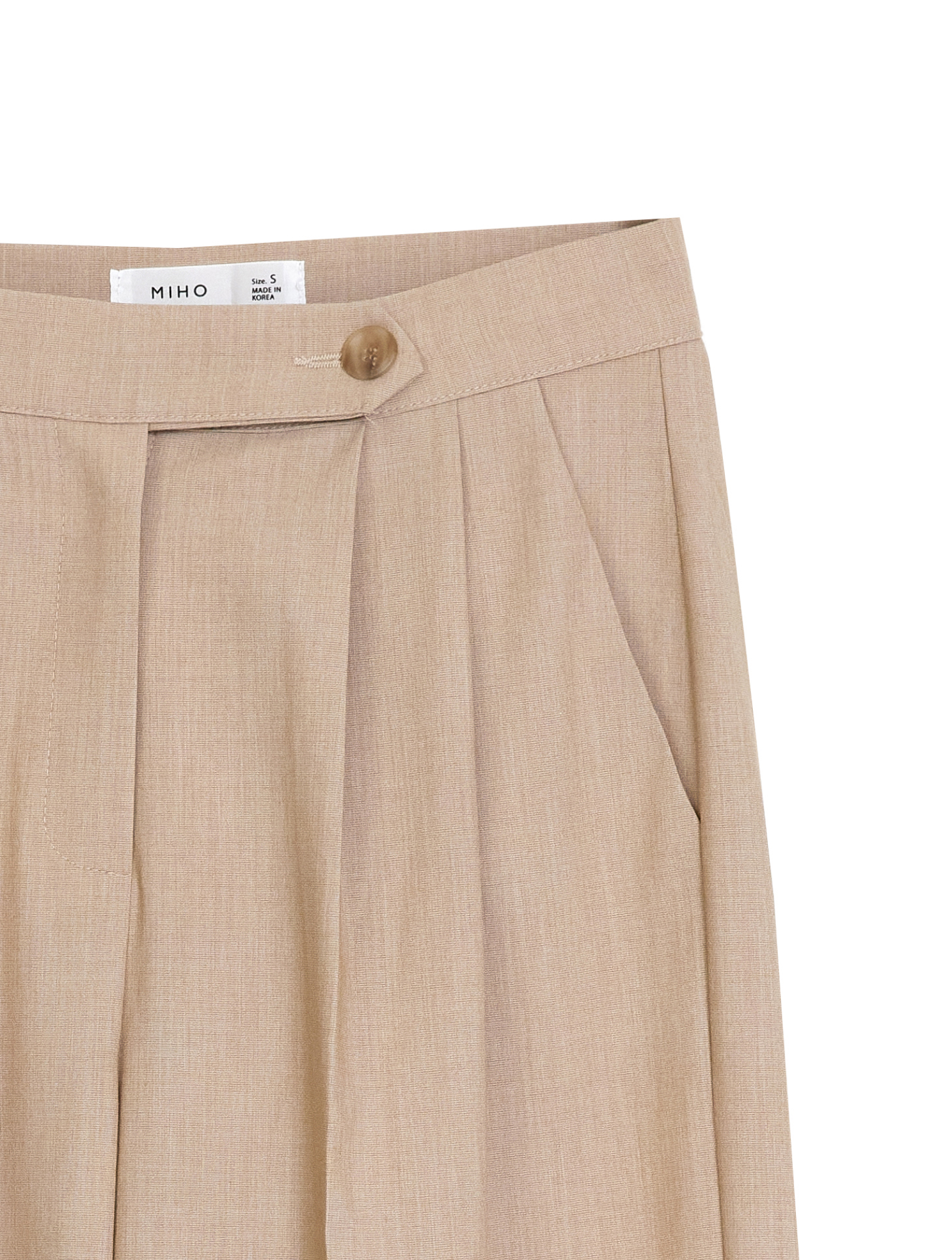 Front zoomed-in shot of the trouser showcasing the pleated design and button fastening detail of the beige button pleated trouser.