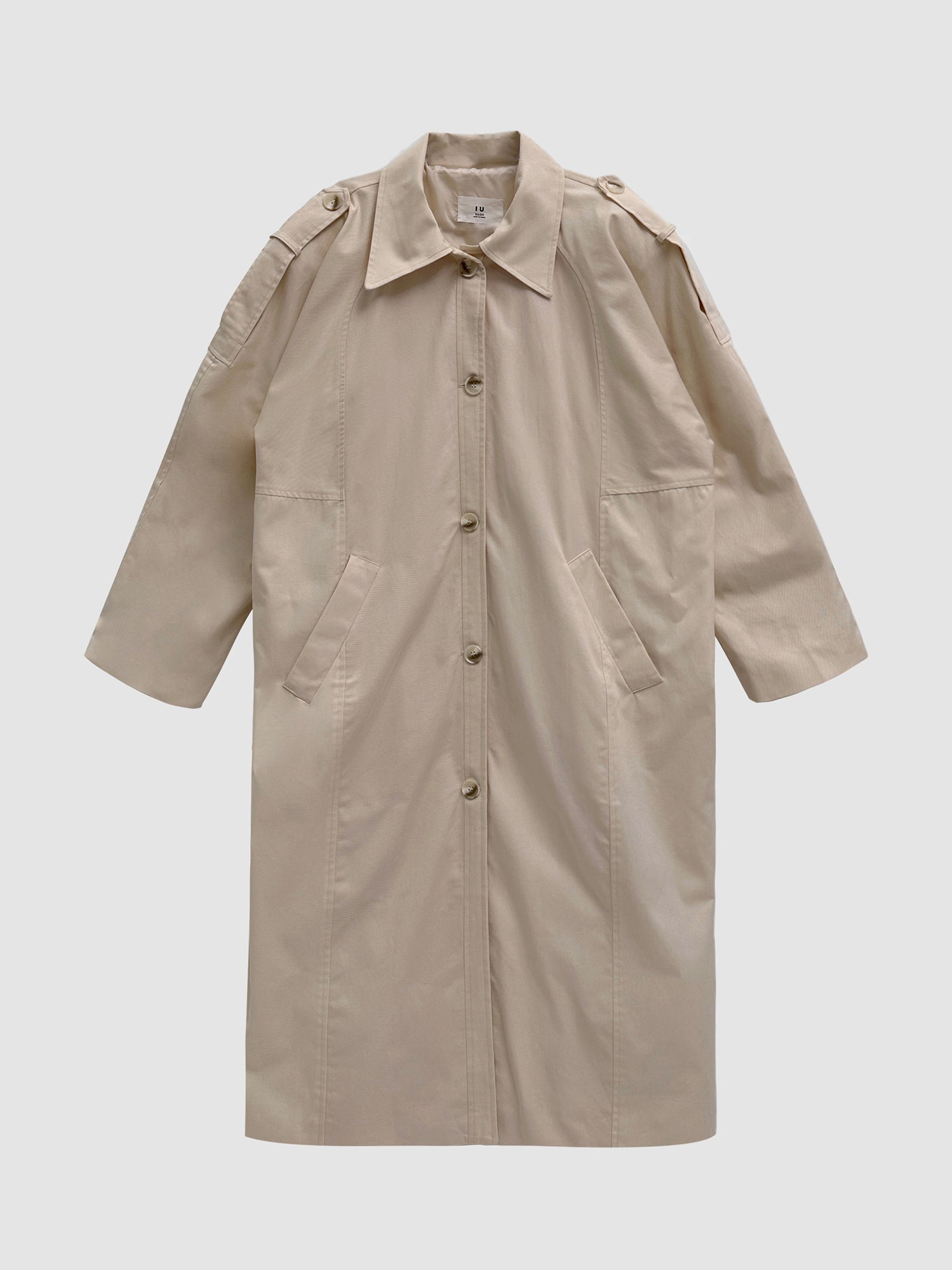 Product detailed view of the trench coat with gray backdrop showing the front detailed view of the coat.