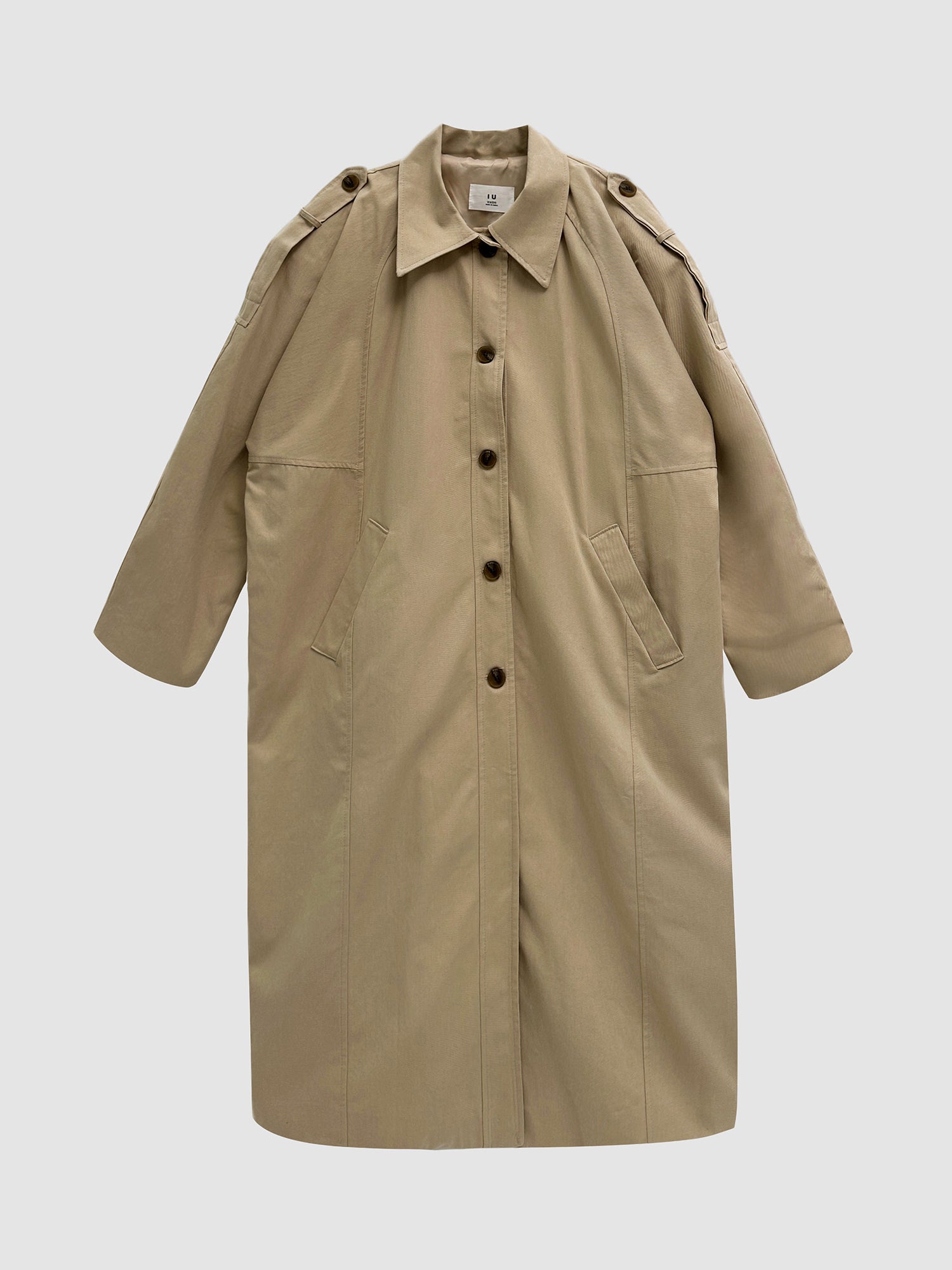 Front detailed view of the khaki trench coat with gray backdrop.