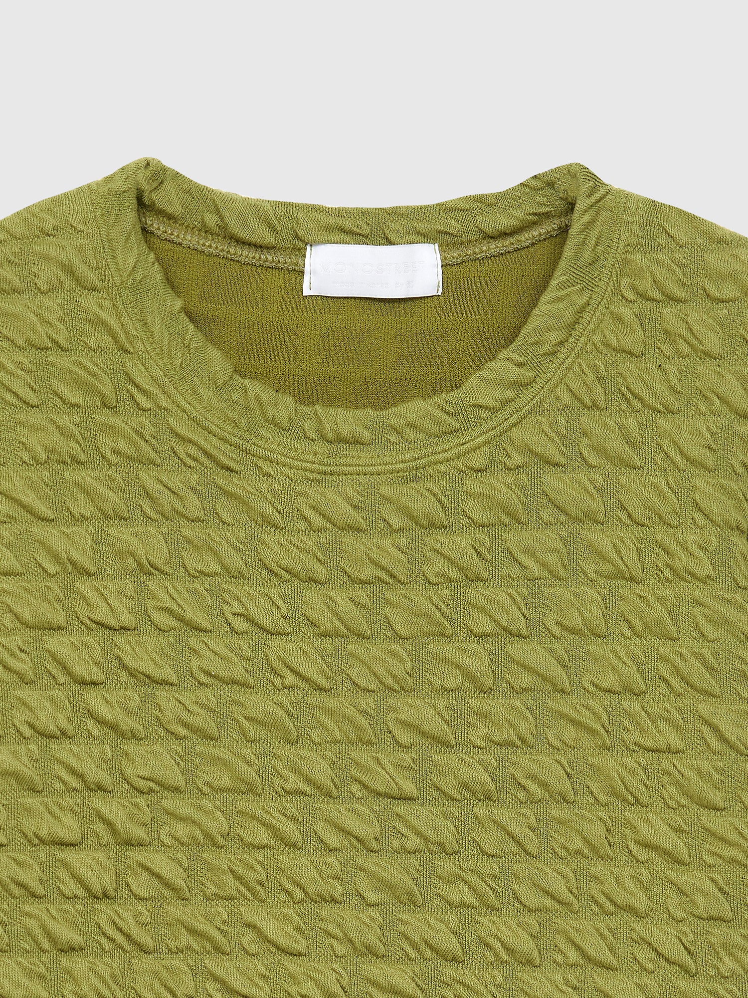 A close-up shot of the waffle textured top showing the fabric detail.