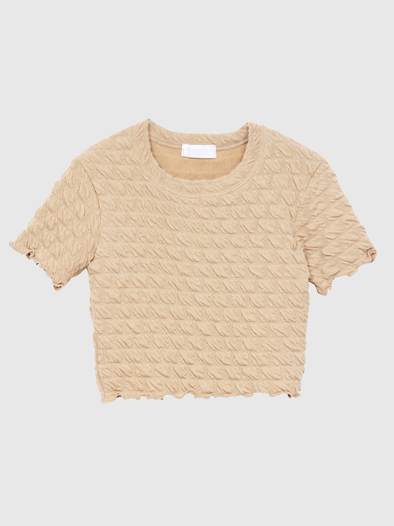 Product detailed view of the beige waffle textured top, showcasing the front side and embodying a touch of Korean street fashion.