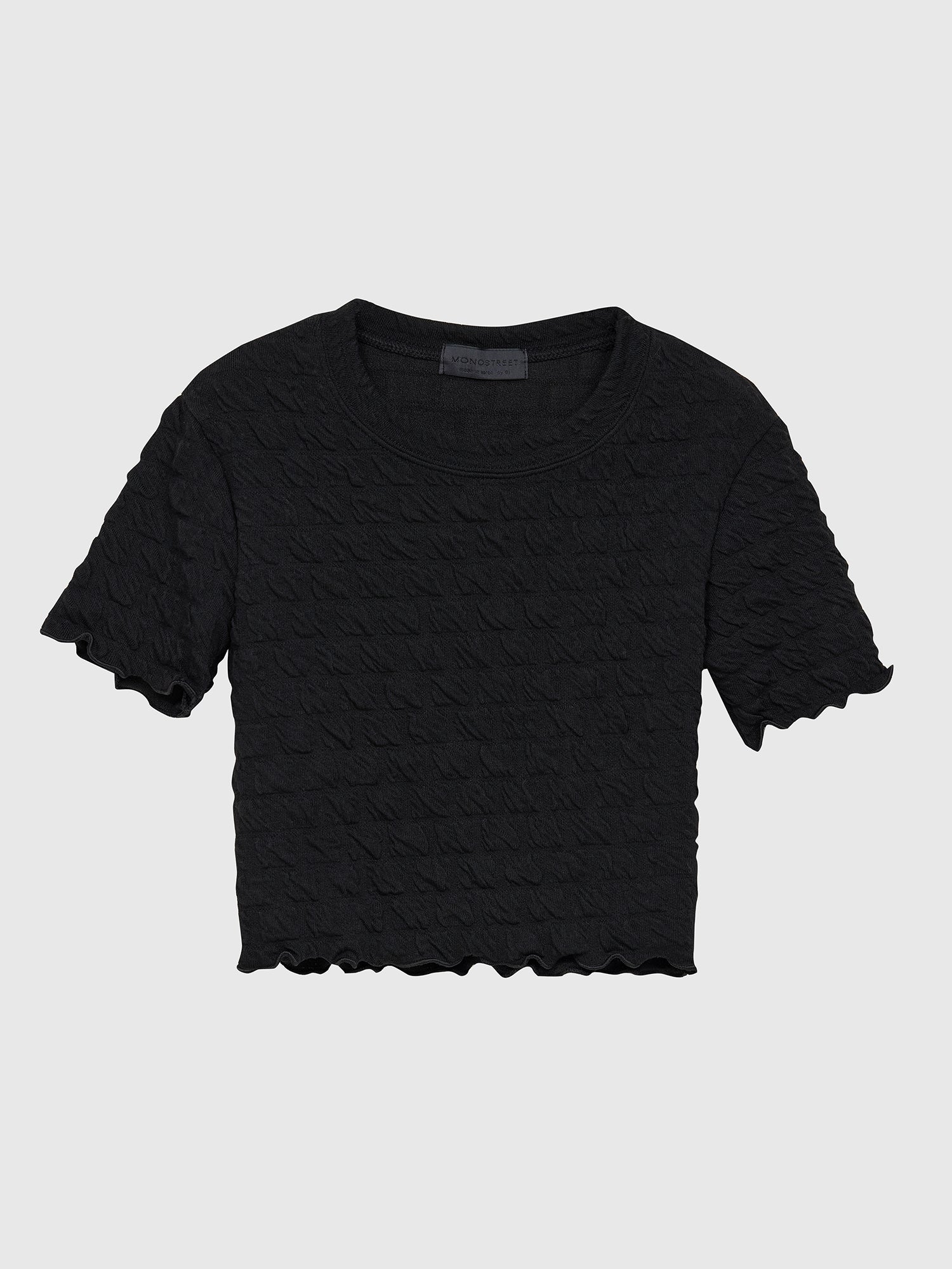 Front view of the black waffle textured top showing the front detail.